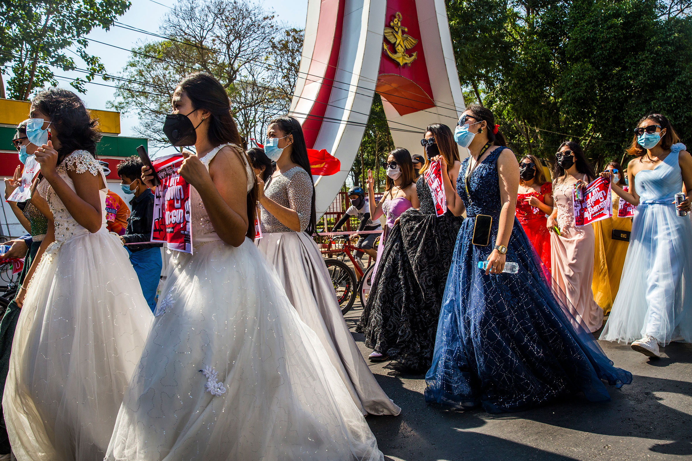 A group of women wearing formal gowns march in Yangon, Myanmar, on Feb. 10, 2021, to protest against the military coup.