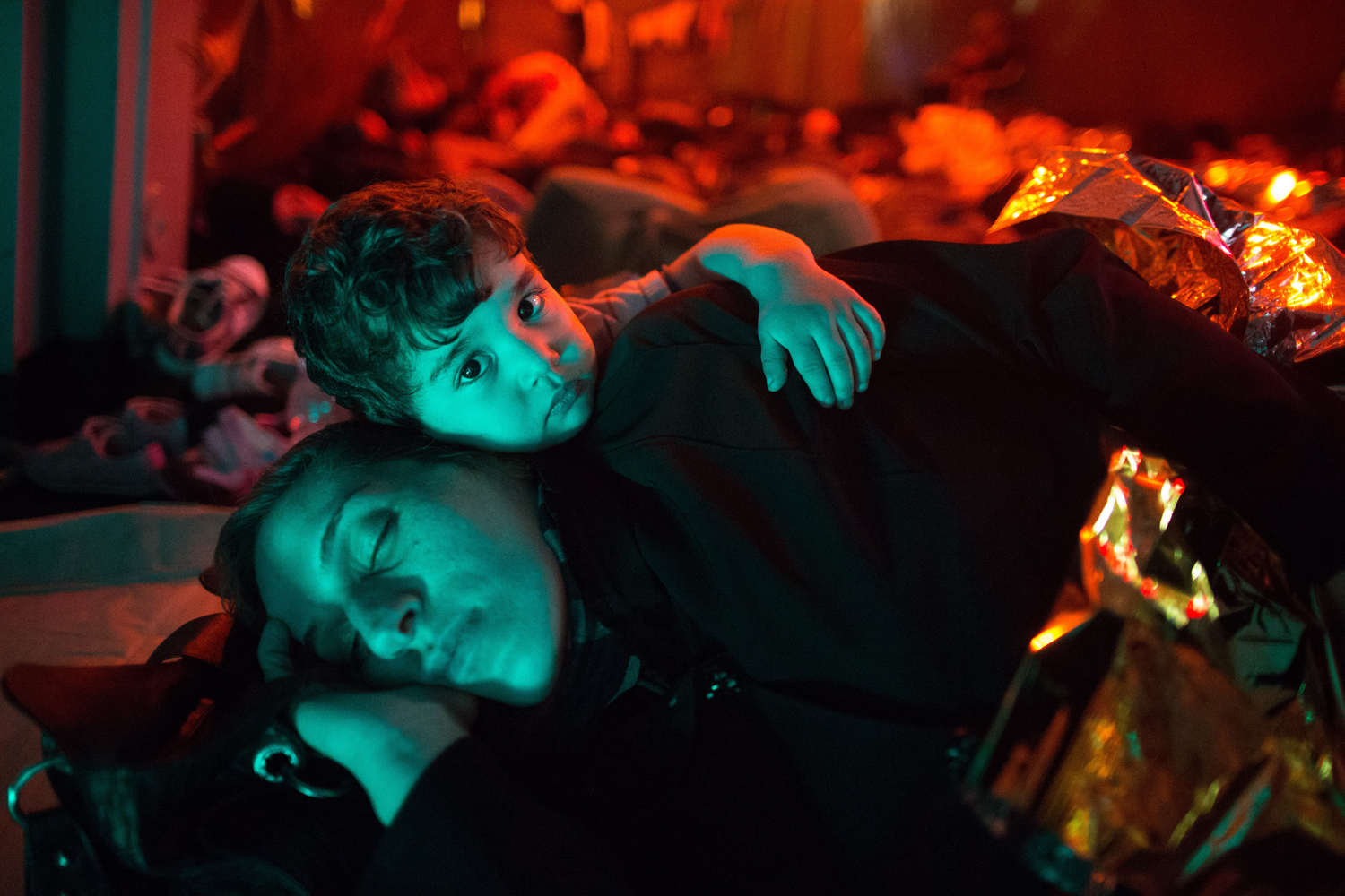 A mother and child on a Italian navy ship after being rescued from a fishing vessel carrying 443 Syrian asylum seekers, June 5.