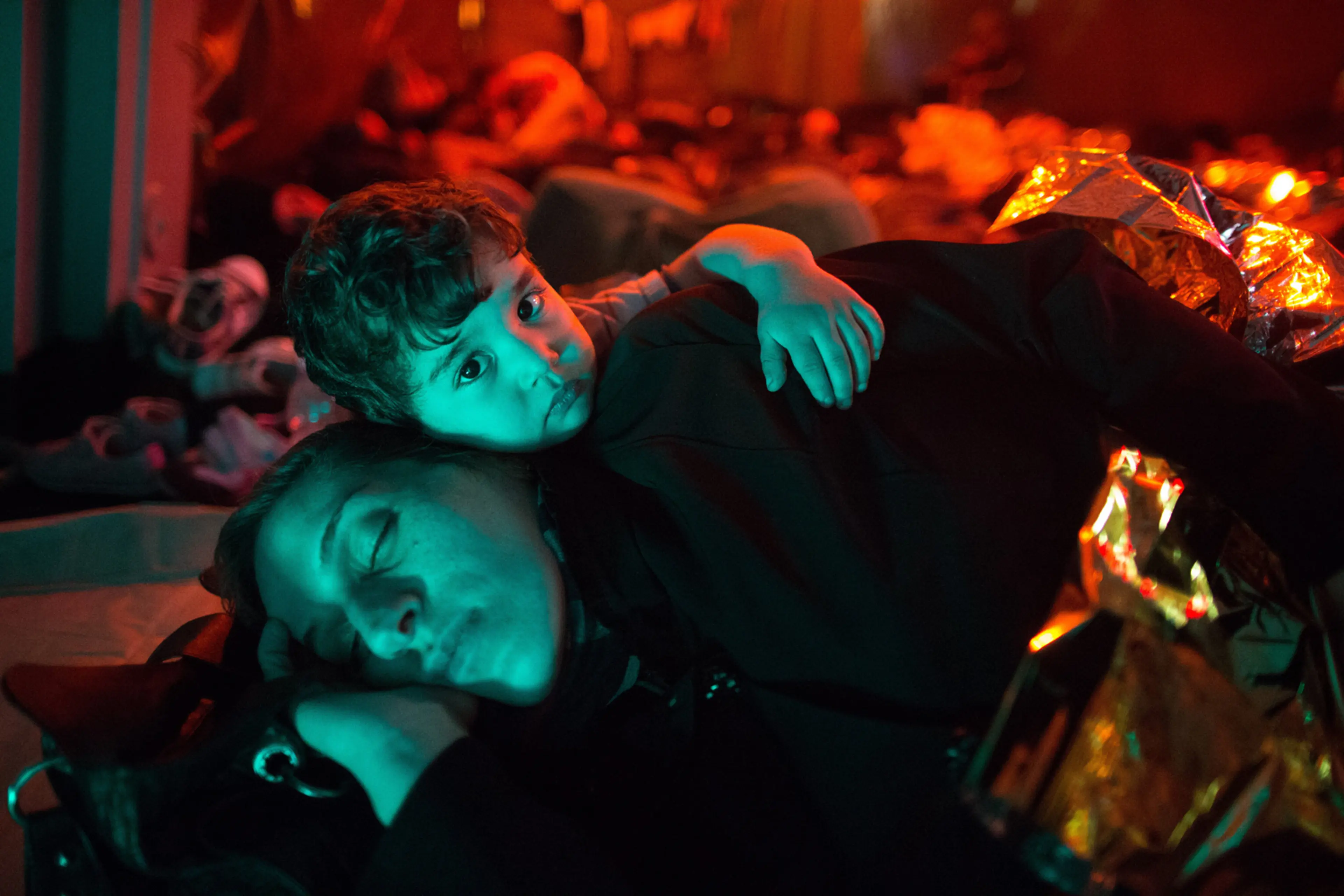 A mother and child on a Italian navy ship after being rescued from a fishing vessel carrying 443 Syrian asylum seekers, June 5.
