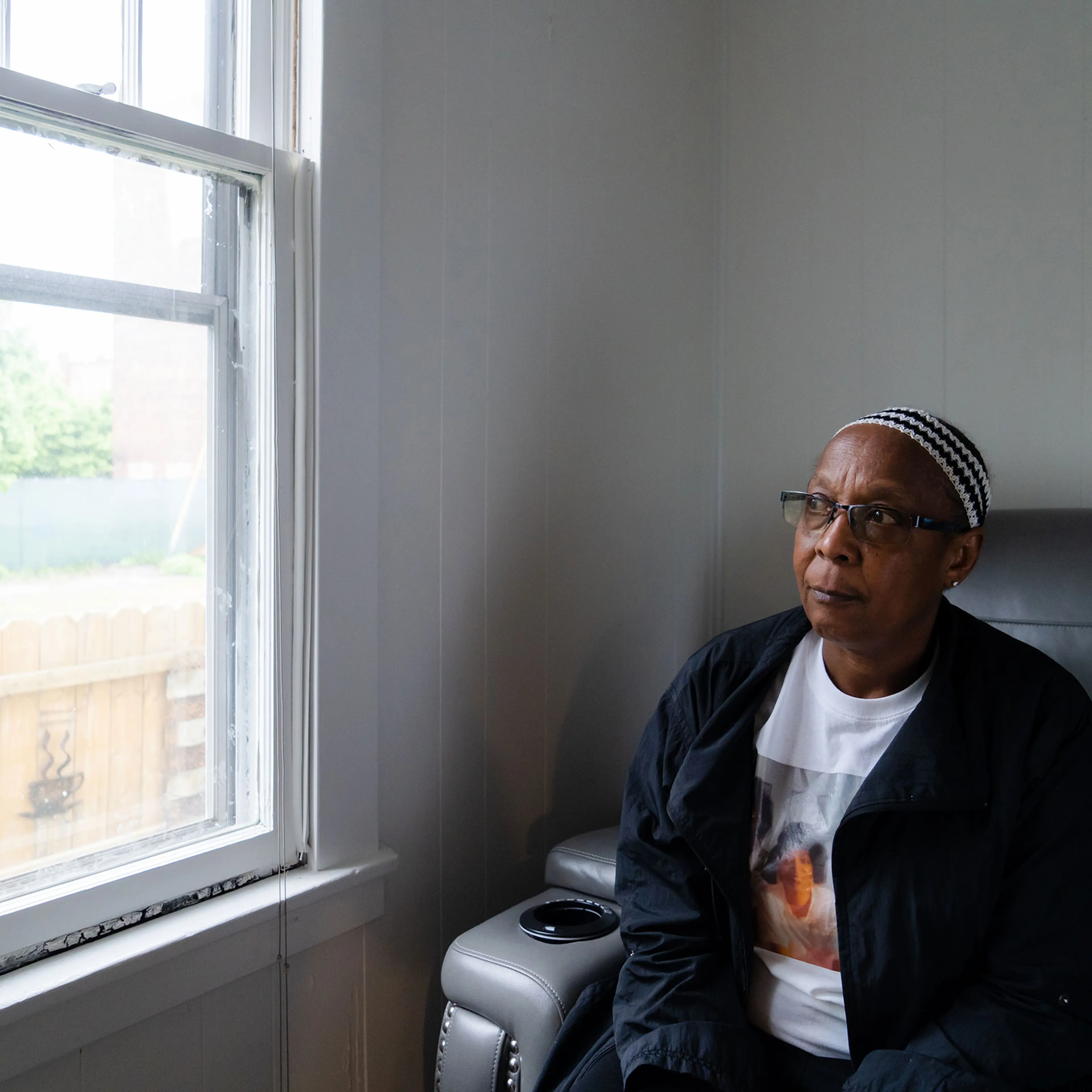 Barbara Mapps, sister of Katherine Massey, looks out the window of her sisters home.
