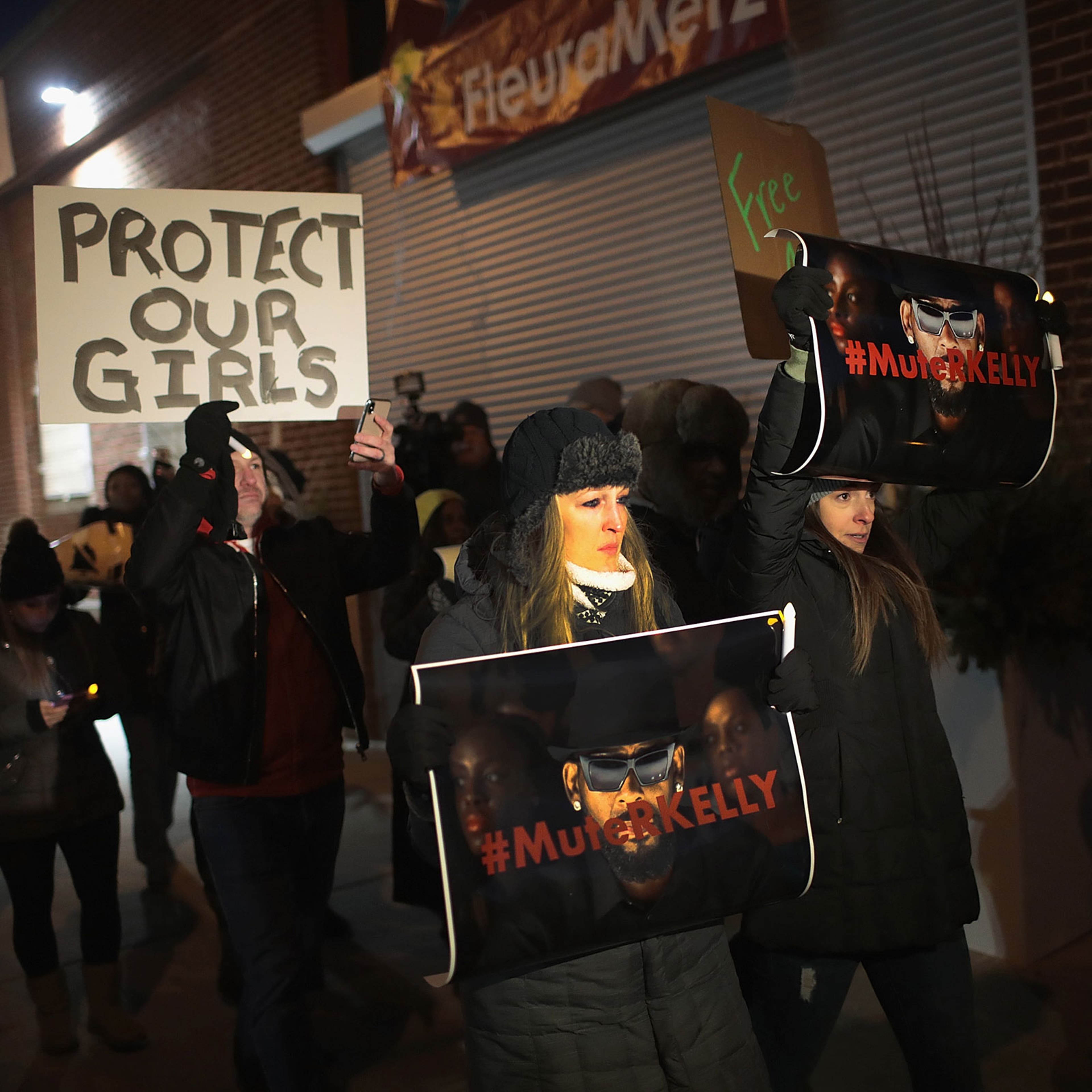 Demonstrators gather near the studio of singer R. Kelly to call for a boycott of his music after allegations of sexual abuse against young girls in Chicago, on Jan. 09, 2019.