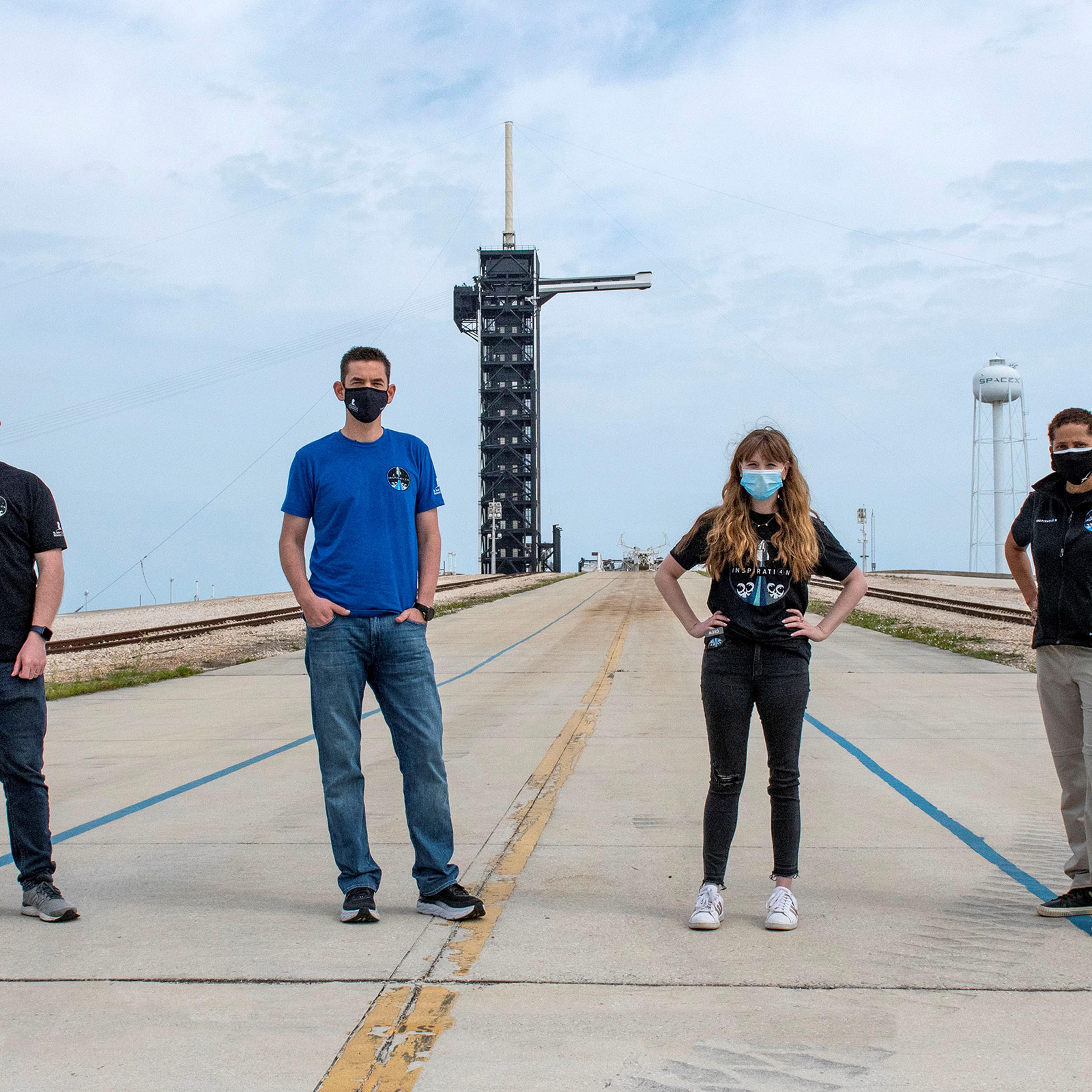 Jared Isaacman, Hayley Arceneaux, Sian Proctor and Chris Sembroski pose for a photo at NASA's Kennedy Space Center at Cape Canaveral, Florida, on March 29.