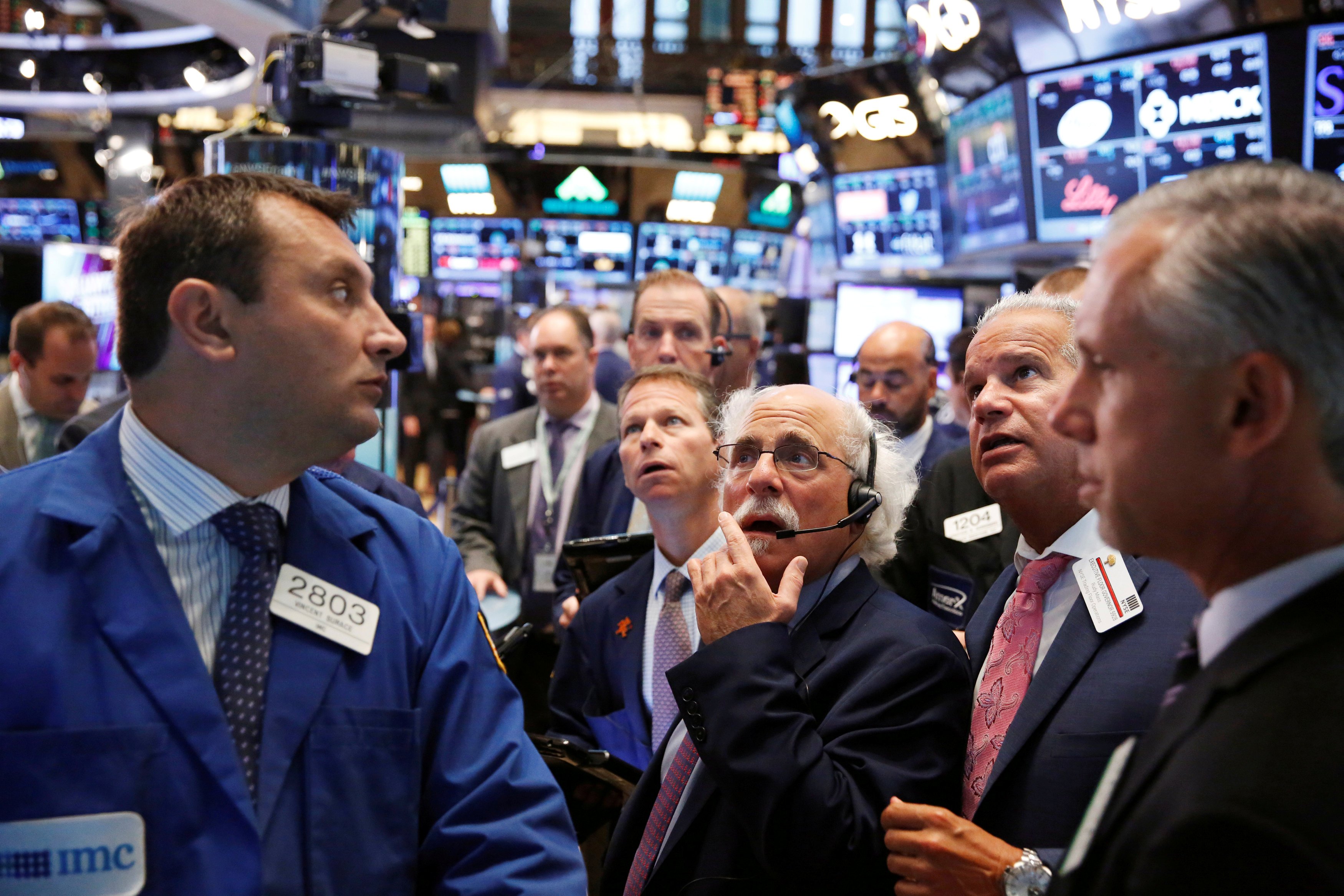 Traders work on the floor of the New York Stock Exchange (NYSE) shortly after the opening bell in New York, U.S., Aug. 30, 2016.