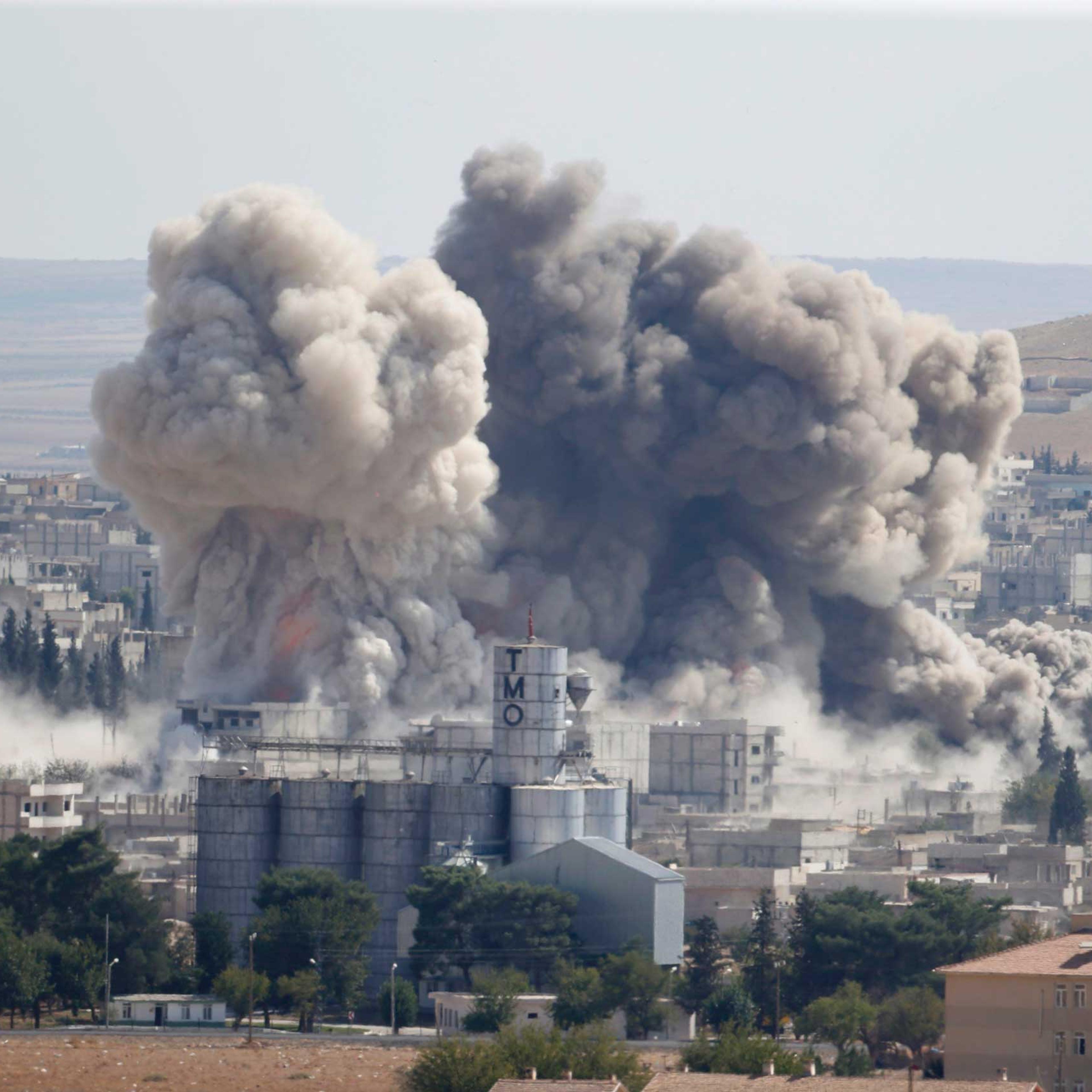 Smoke rises after an U.S.-led air strike in the Syrian town of Kobani, Oct. 8, 2014.