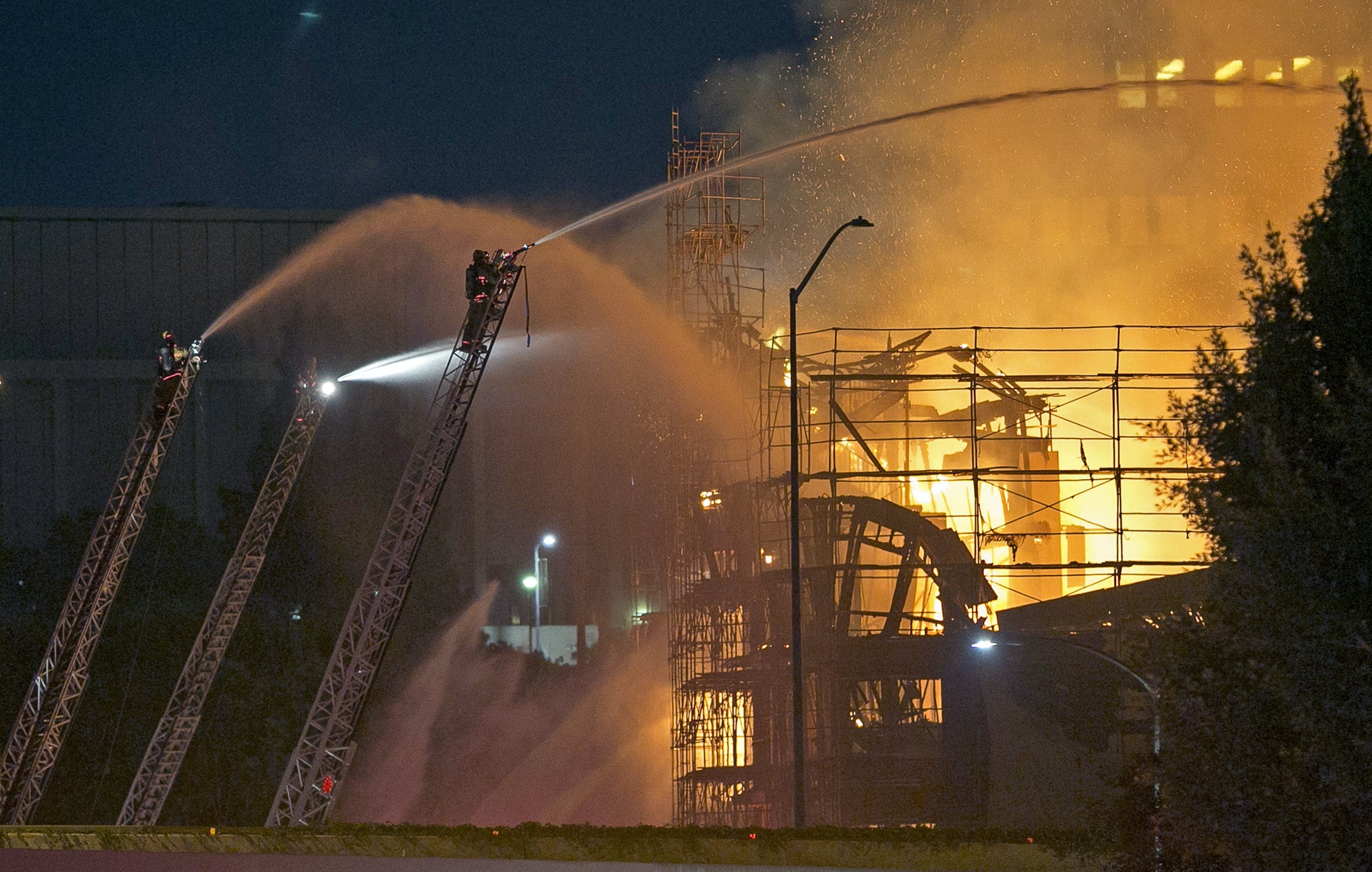 Los Angeles firefighters battle a fire in the seven-story Da Vinci apartment complex under construction in downtown Los Angeles, Dec. 8, 2014.