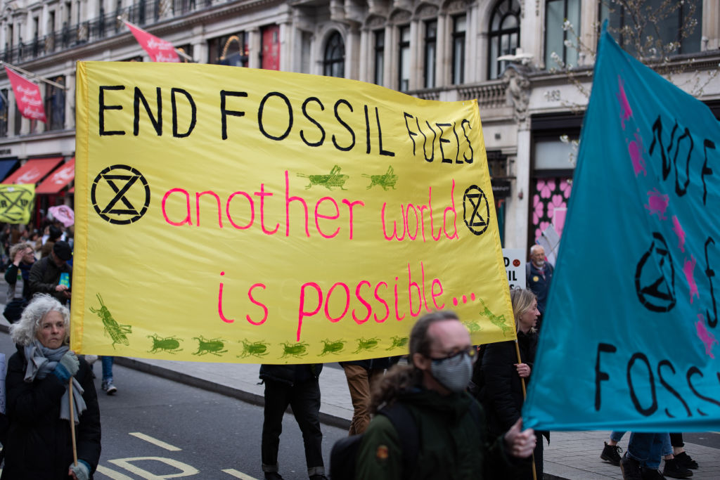 Protesters march with banners during the demonstration