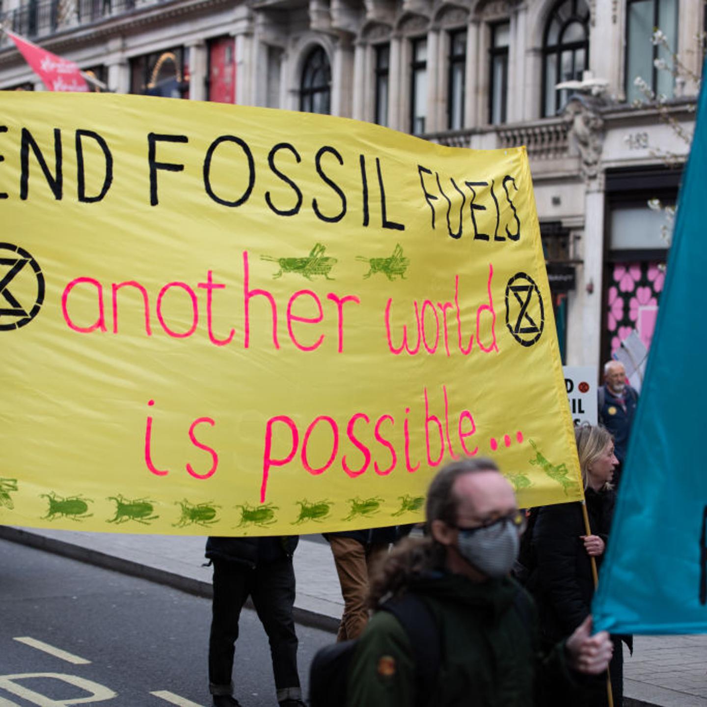 Protesters march with banners during the demonstration