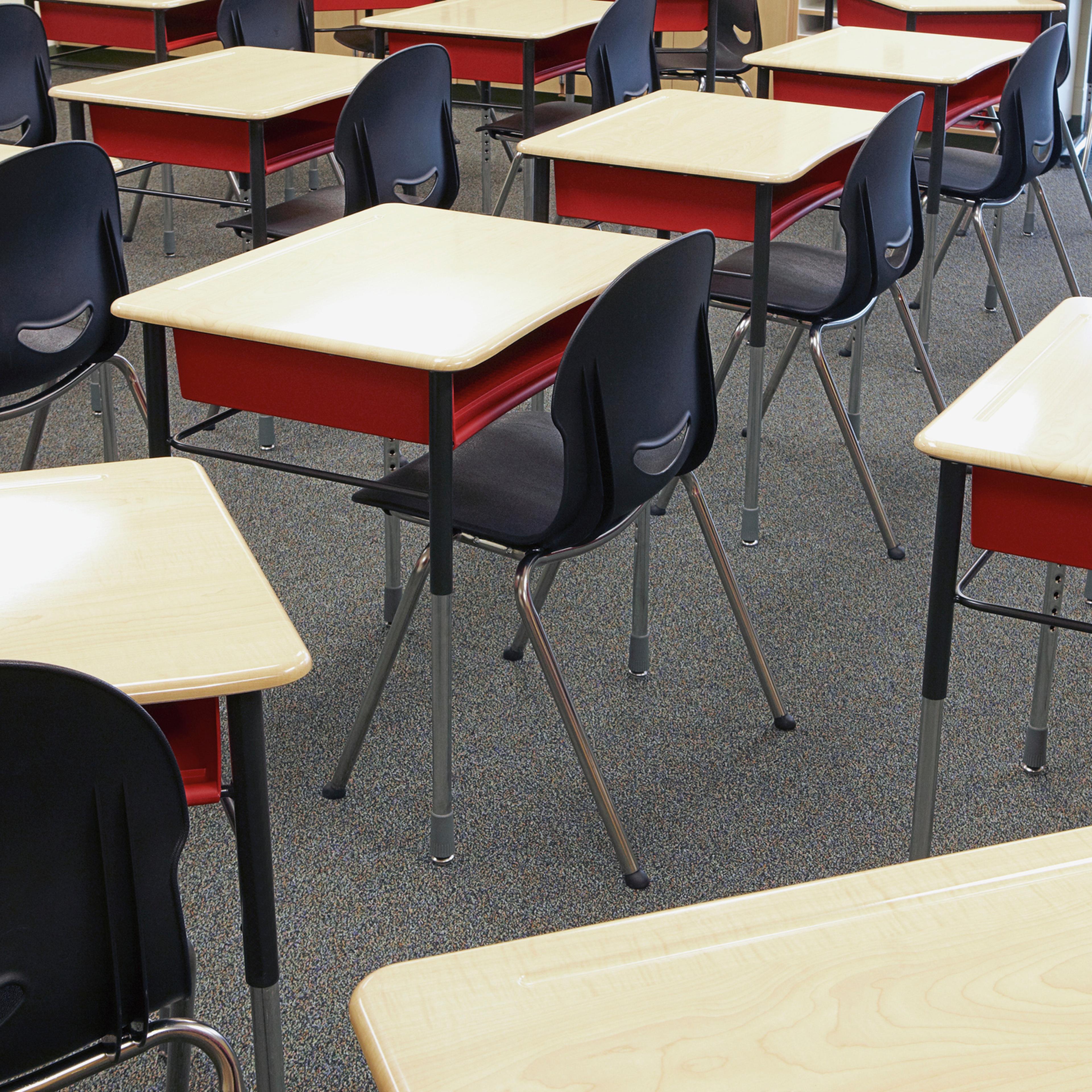Desks and chairs in empty classroom