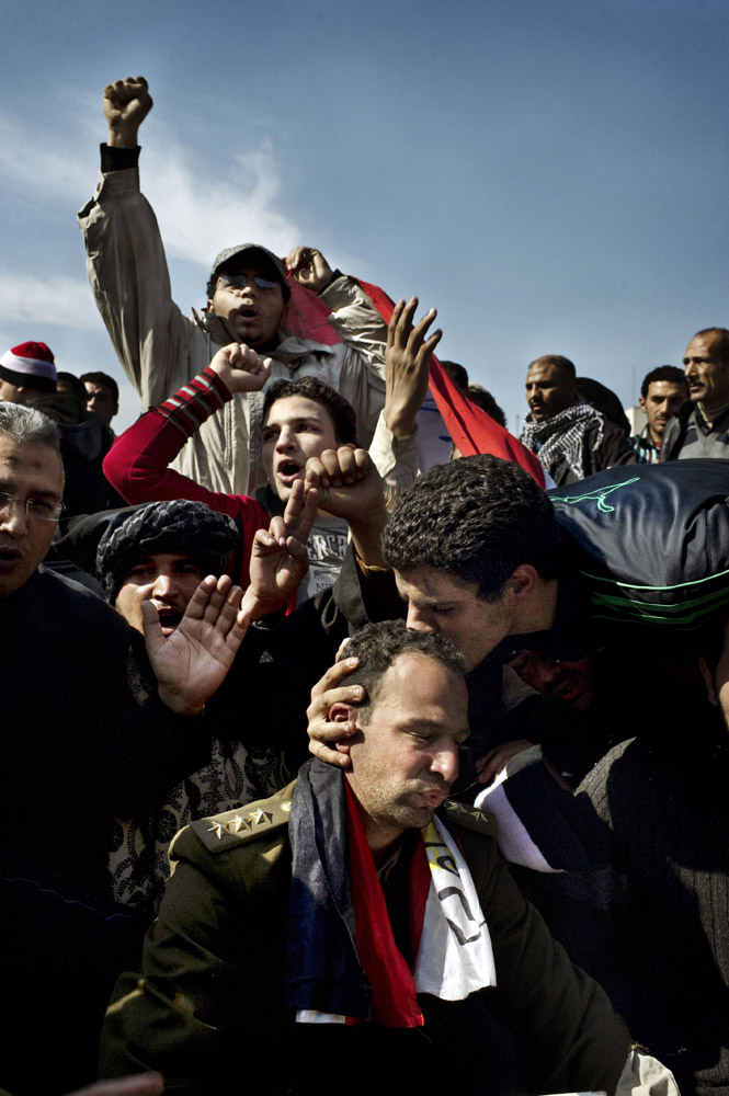 <b>Yuri Kozyrev. From "The Revolutionaries." February 14, 2011 issue.</b>
<br><br>
To win the army over to their side, protest leaders urged people to "hug a soldier."