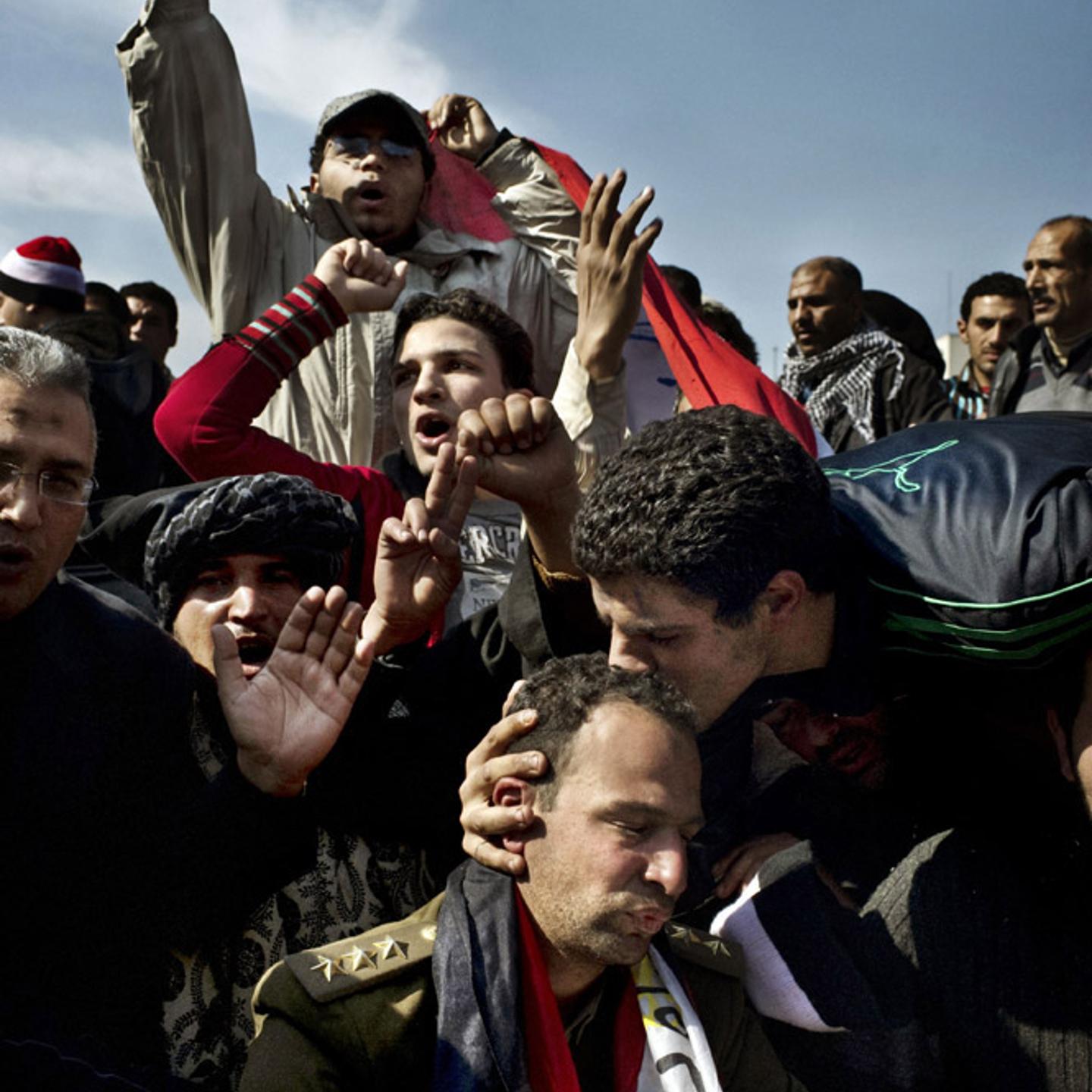 <b>Yuri Kozyrev. From "The Revolutionaries." February 14, 2011 issue.</b>
<br><br>
To win the army over to their side, protest leaders urged people to "hug a soldier."
