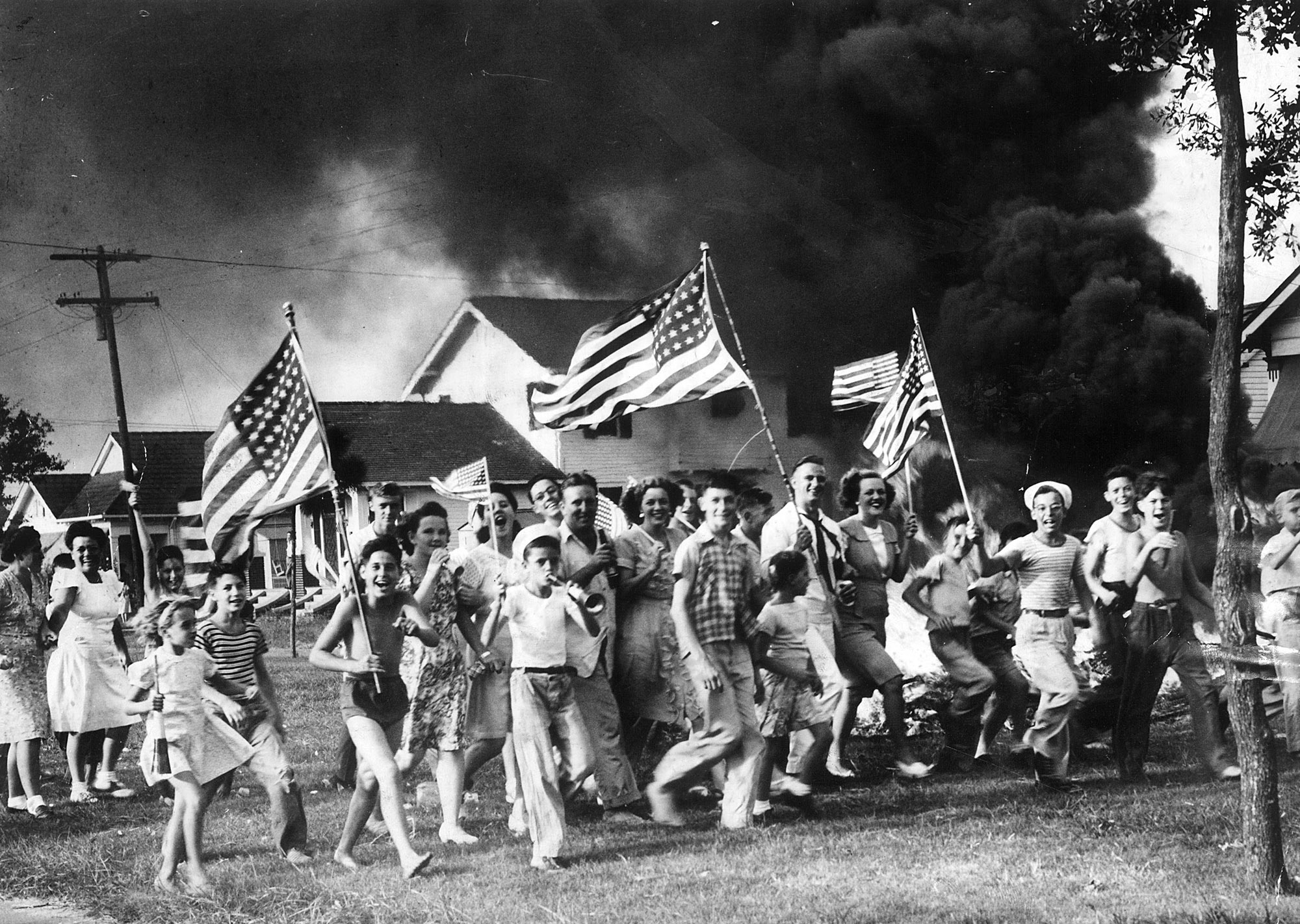V-J Day New Orleanians, after celebrating the end of the war prematurely three times, let loose with everything they had when the official world of peace spread through the streets Tuesday near dinner time.