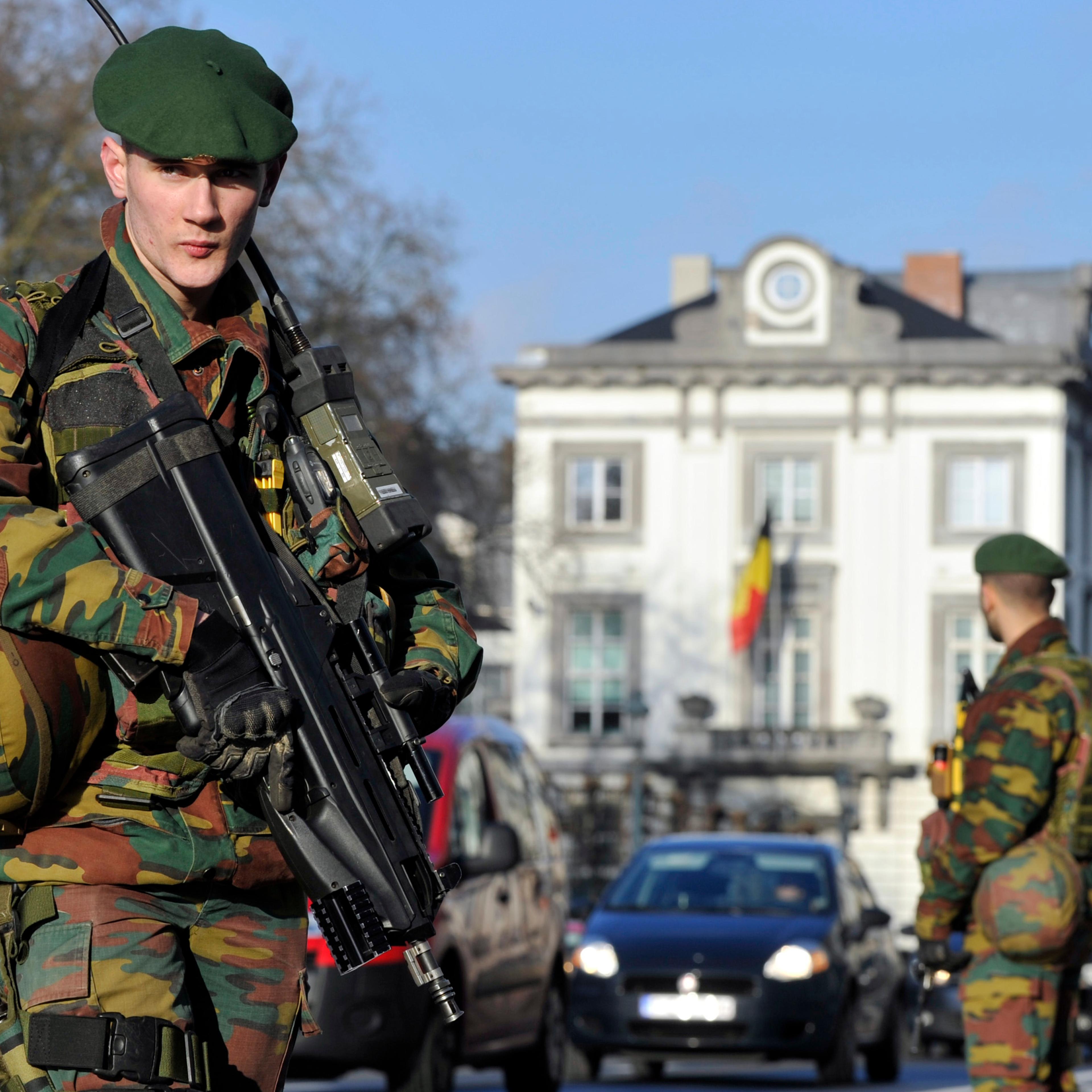 Belgian soldiers guard outside the U.S. Embassy in Brussels near the Belgian Parliament on Jan. 17, 2015.