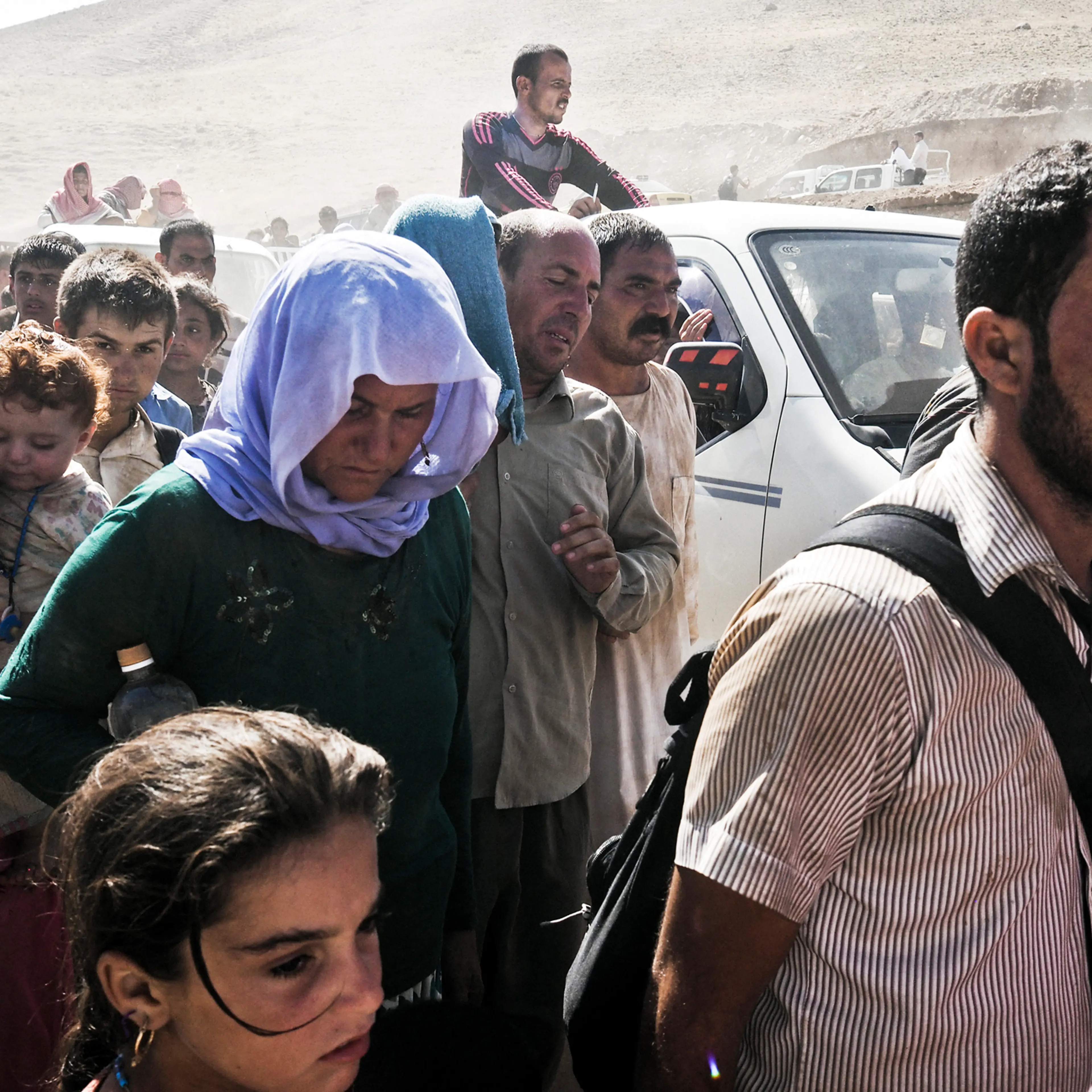Yazidi families from Sinjar arrive at the Fishkhabur border crossing between Iraq's Dohuk Province and Syria, Aug. 10, 2014.