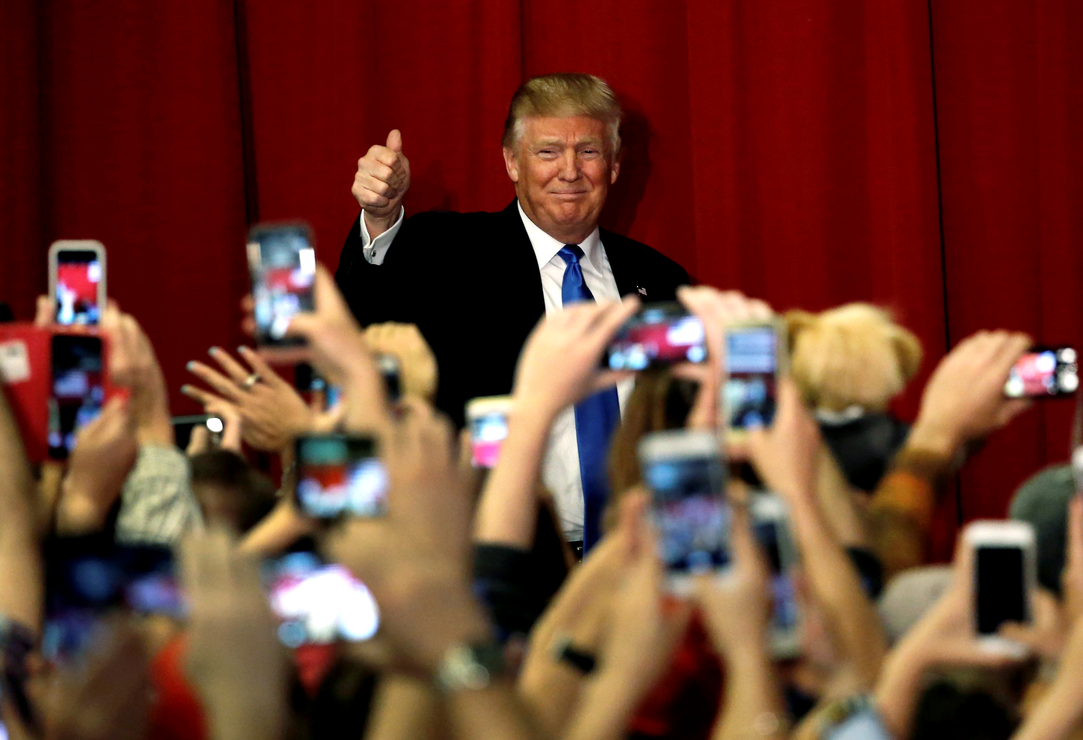 Republican presidential candidate Donald Trump greets supporters as he arrives to appear with New Jersey Governor Chris Christie at a fundraising event in Lawrenceville, N.J. on May 19, 2016.