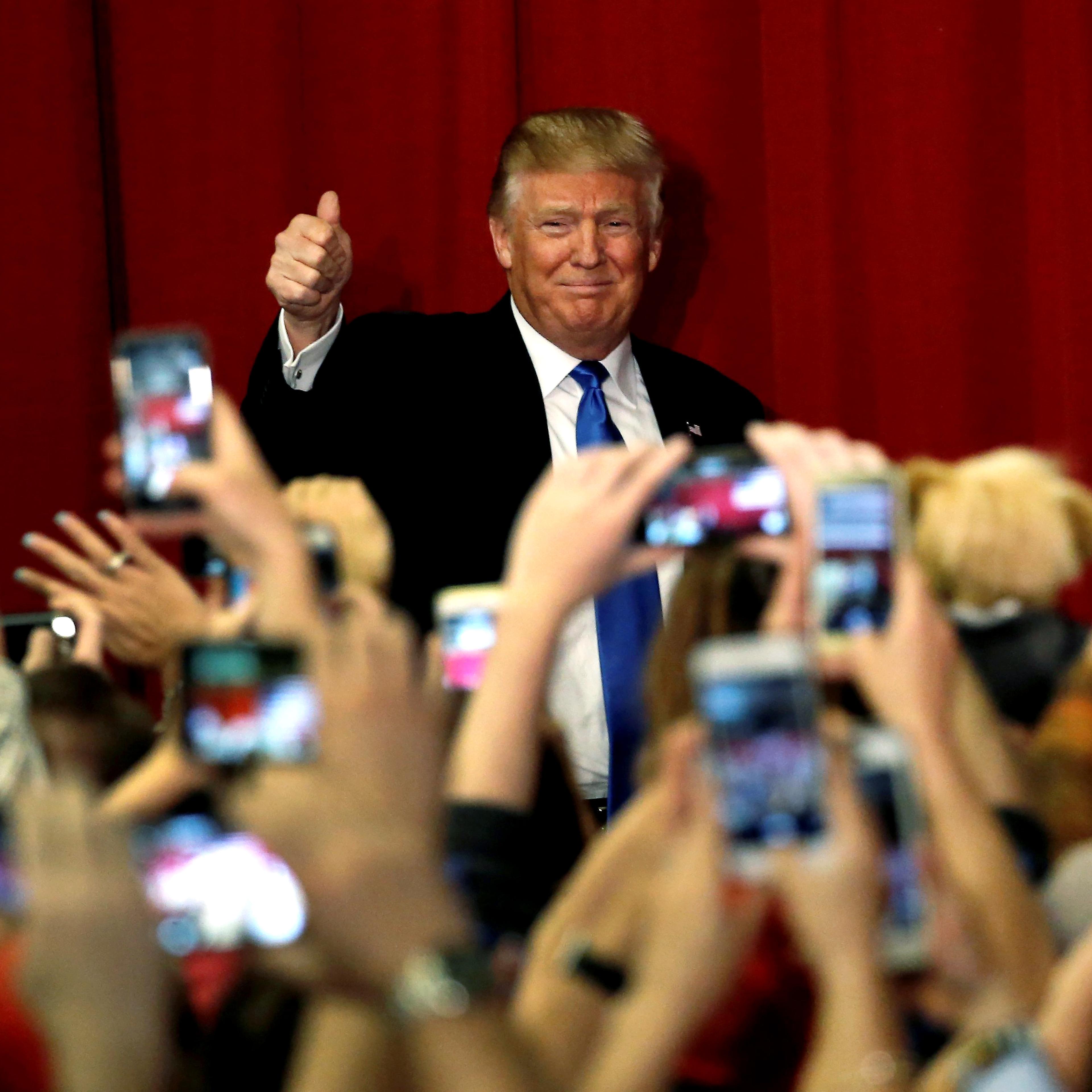 Republican presidential candidate Donald Trump greets supporters as he arrives to appear with New Jersey Governor Chris Christie at a fundraising event in Lawrenceville, N.J. on May 19, 2016.