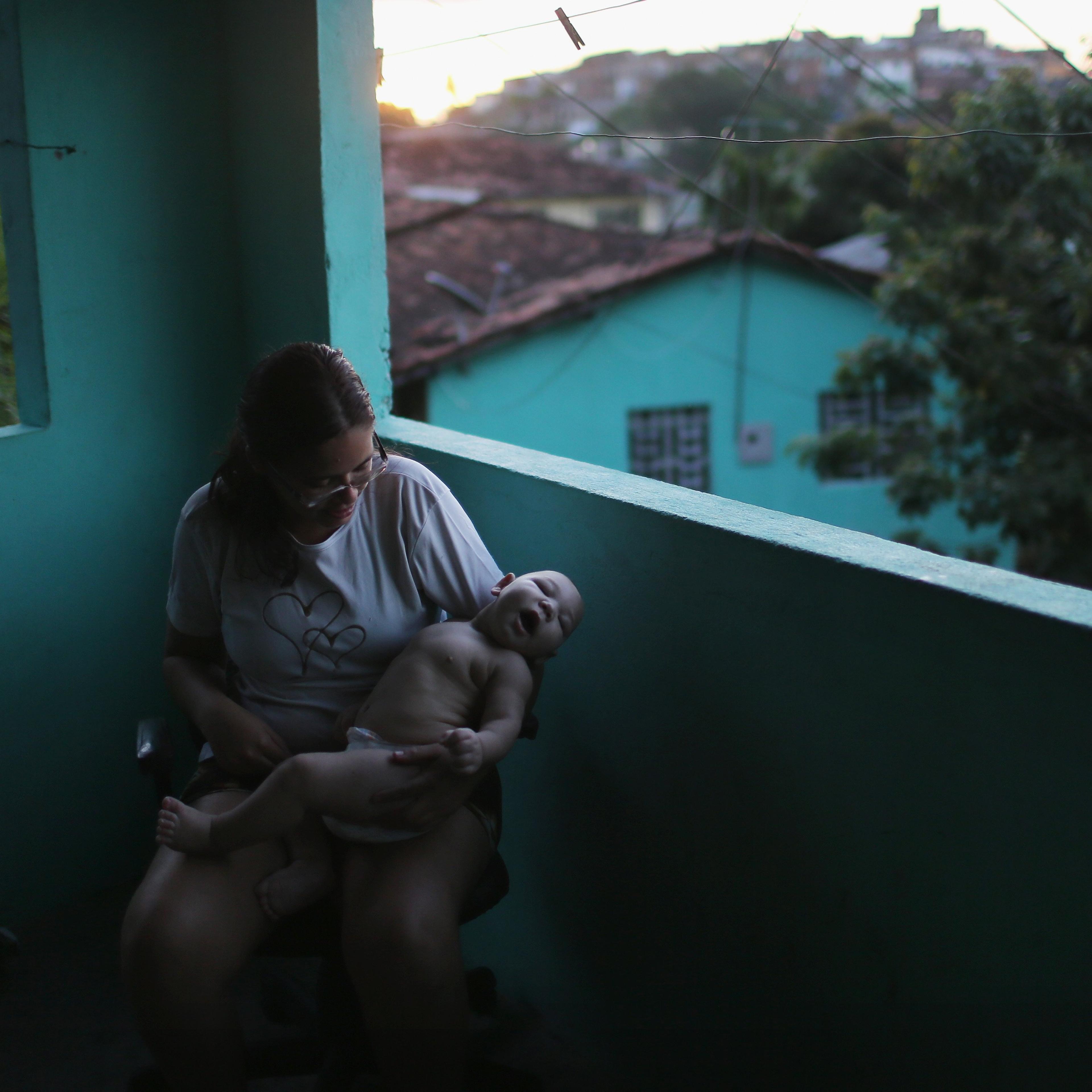 Mylene Helena Ferreira holds her five-month-old son David Henrique Ferreira, who has microcephaly, in Recife, Brazil, Jan. 25, 2016.