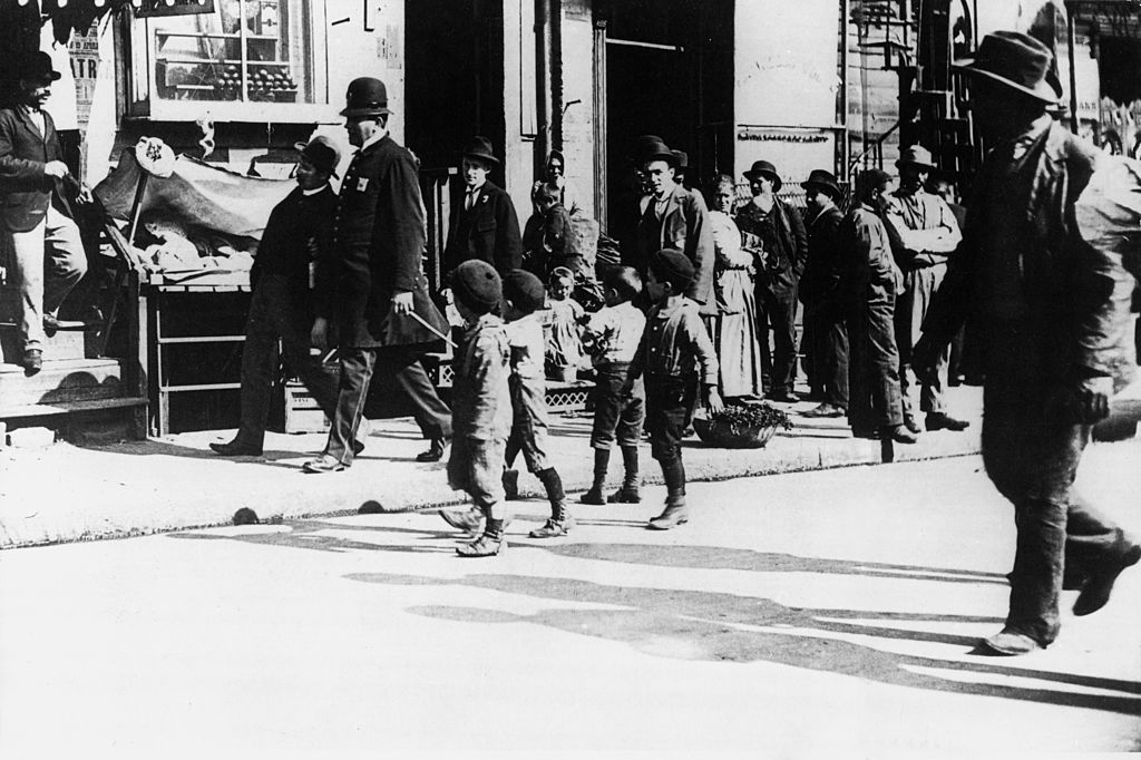 A Group Of Italian Americans In A Street Of Little Italy