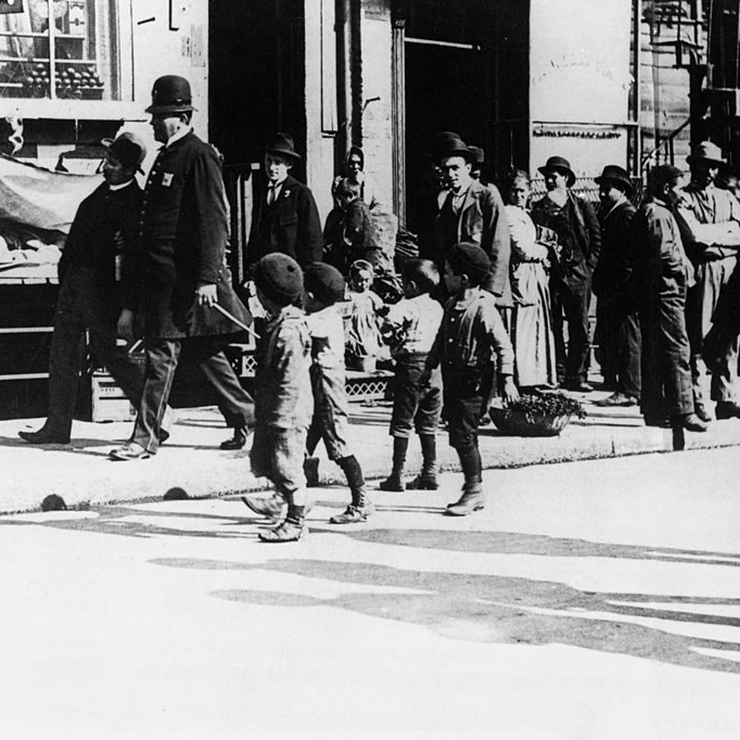 A Group Of Italian Americans In A Street Of Little Italy