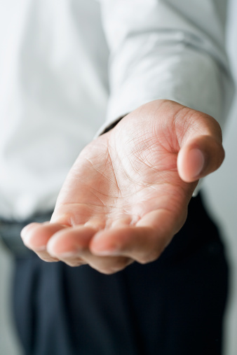 businessman-holding-out-hand