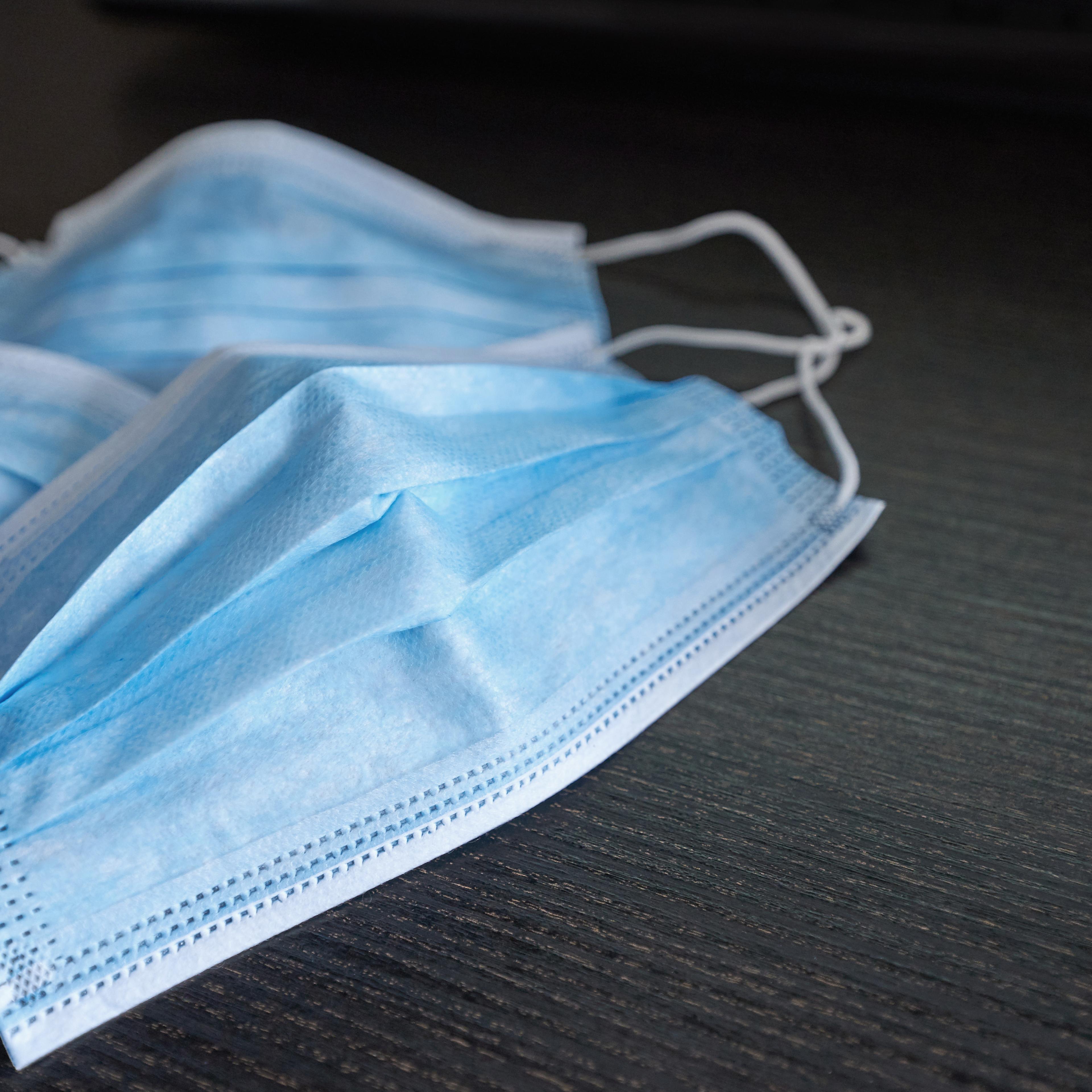 Respiratory mask on desk in office, Protective medical mask with 2019-nCoV, Coronavirus protection concept.