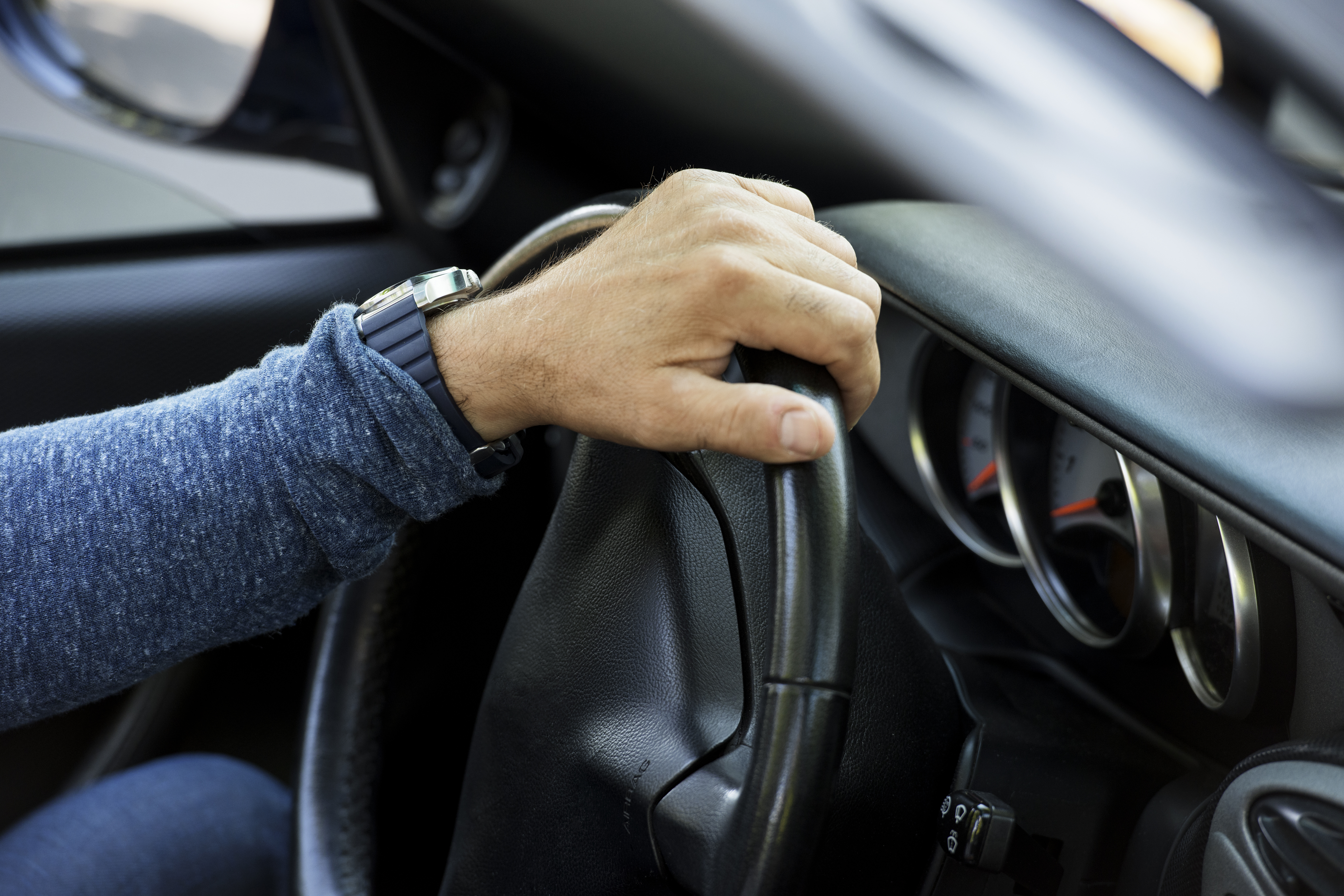 Closeup of hand on steering wheel