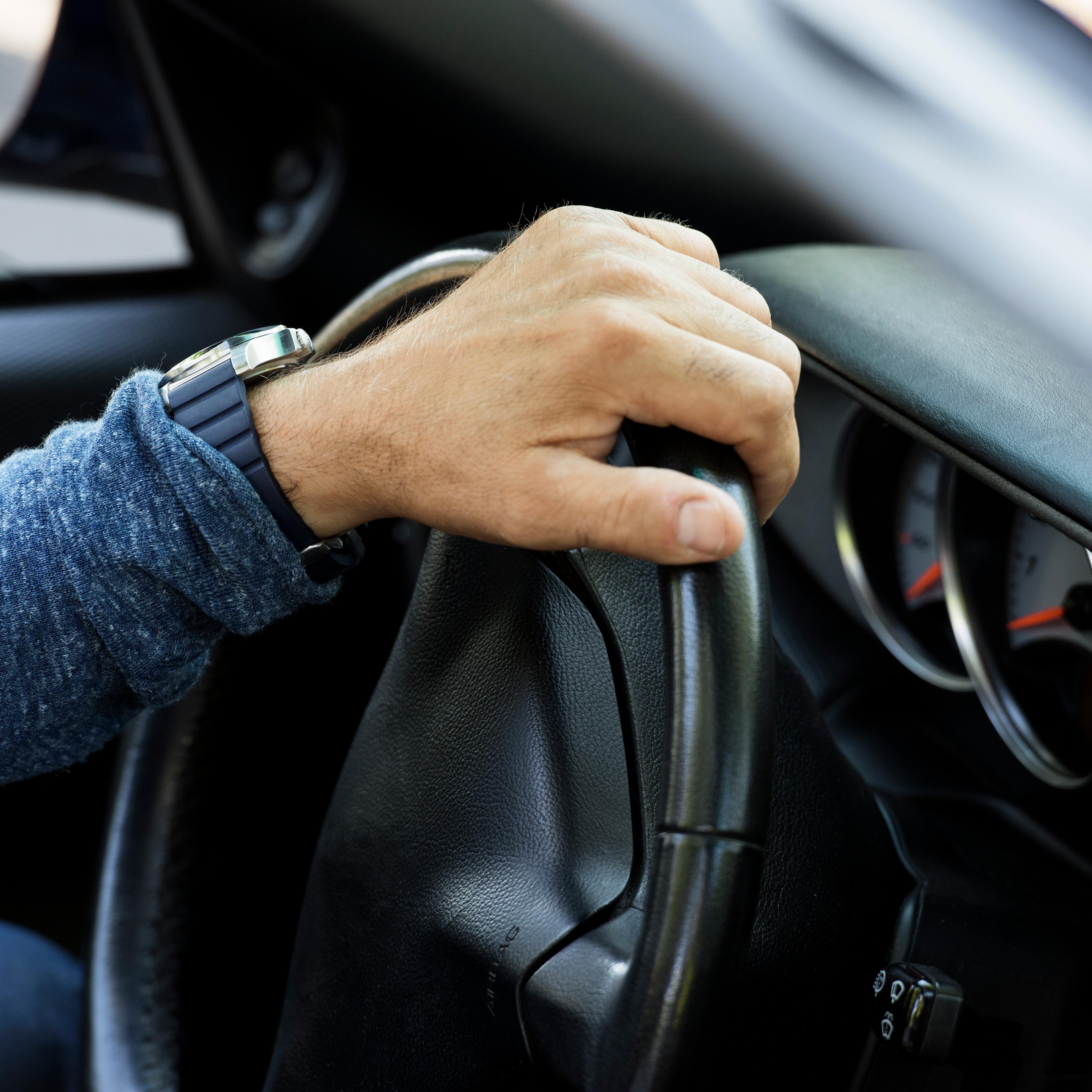 Closeup of hand on steering wheel