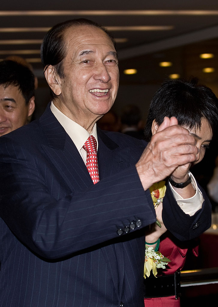 Casino tycoon Stanley Ho gestures during