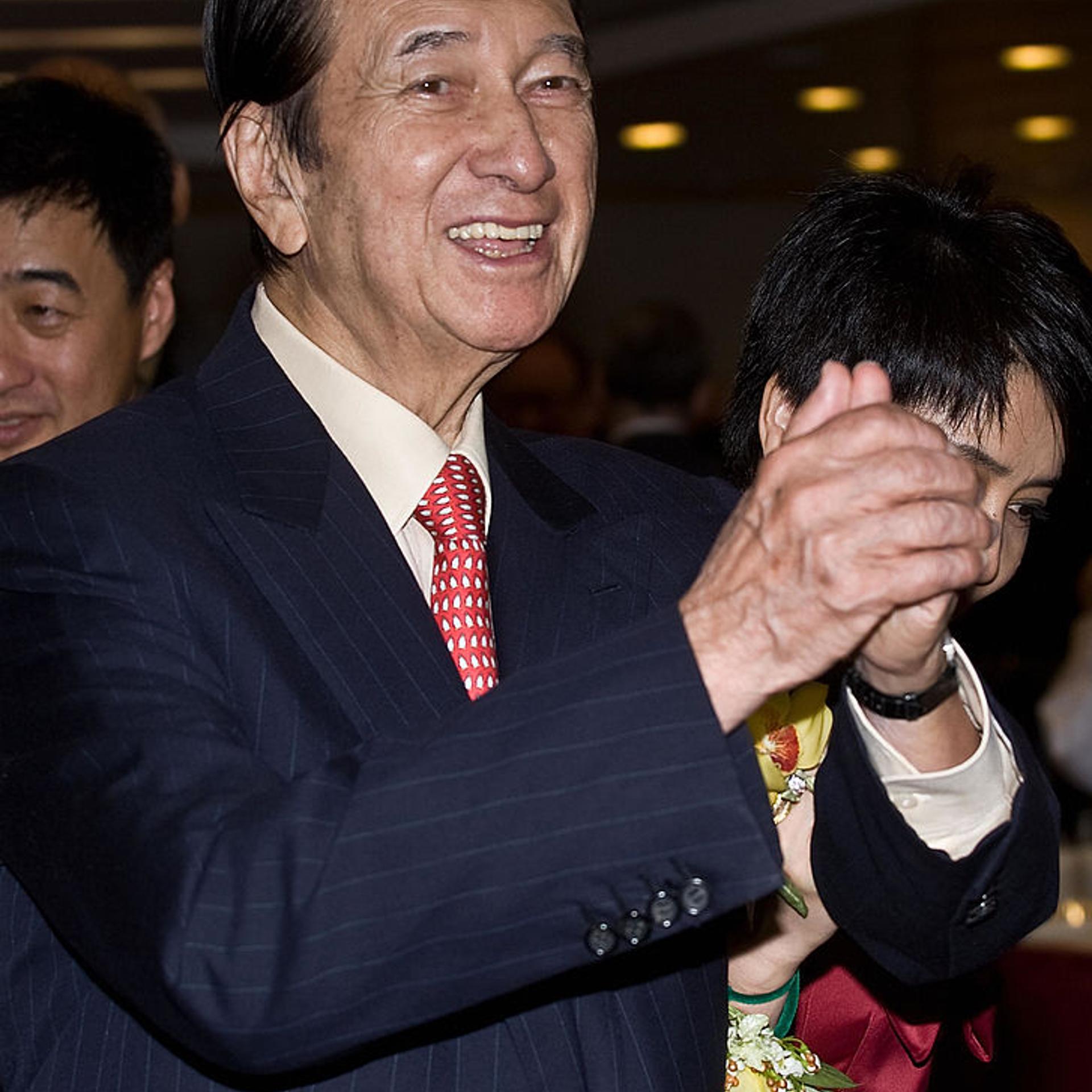 Casino tycoon Stanley Ho gestures during