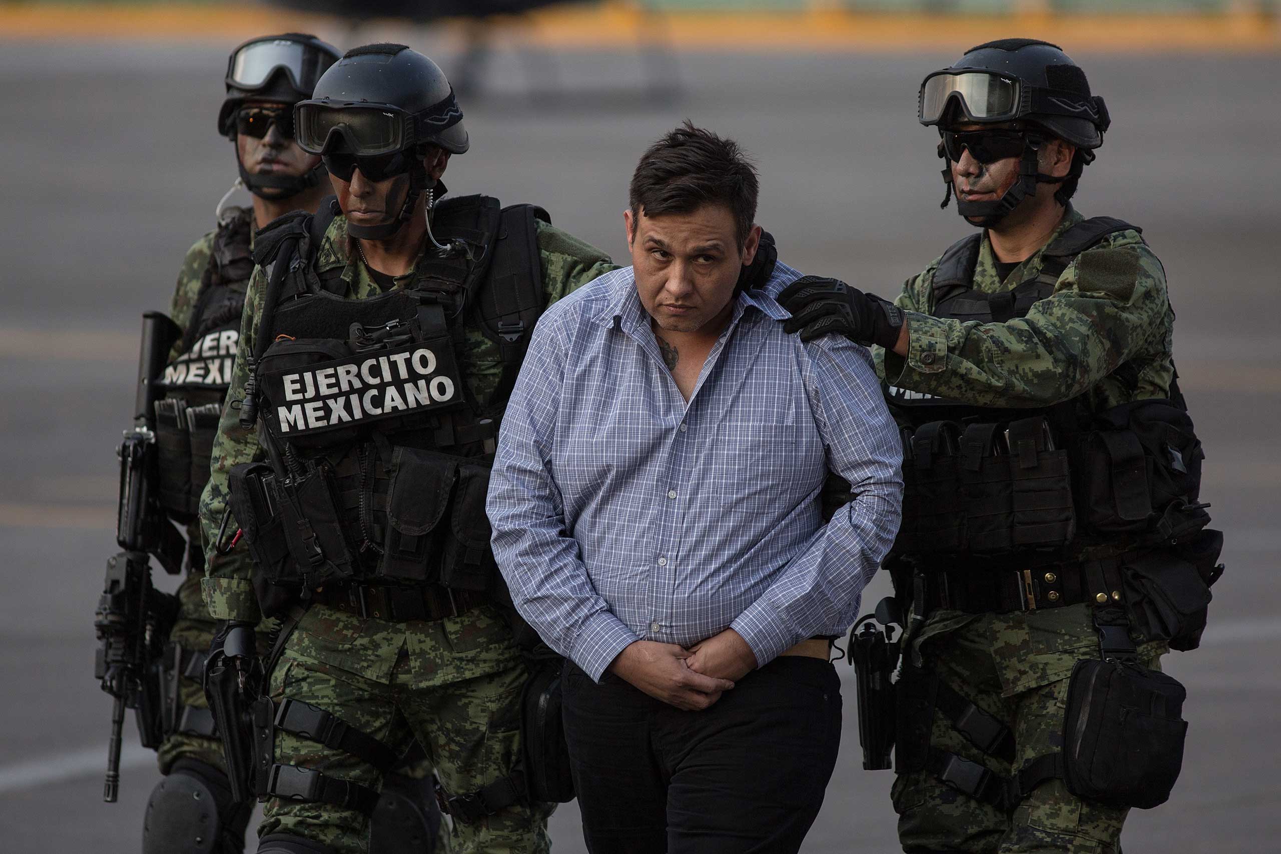 Soldiers escort Los Zetas drug cartel leader Omar Trevino Morales in Mexico City on March 4, 2015.