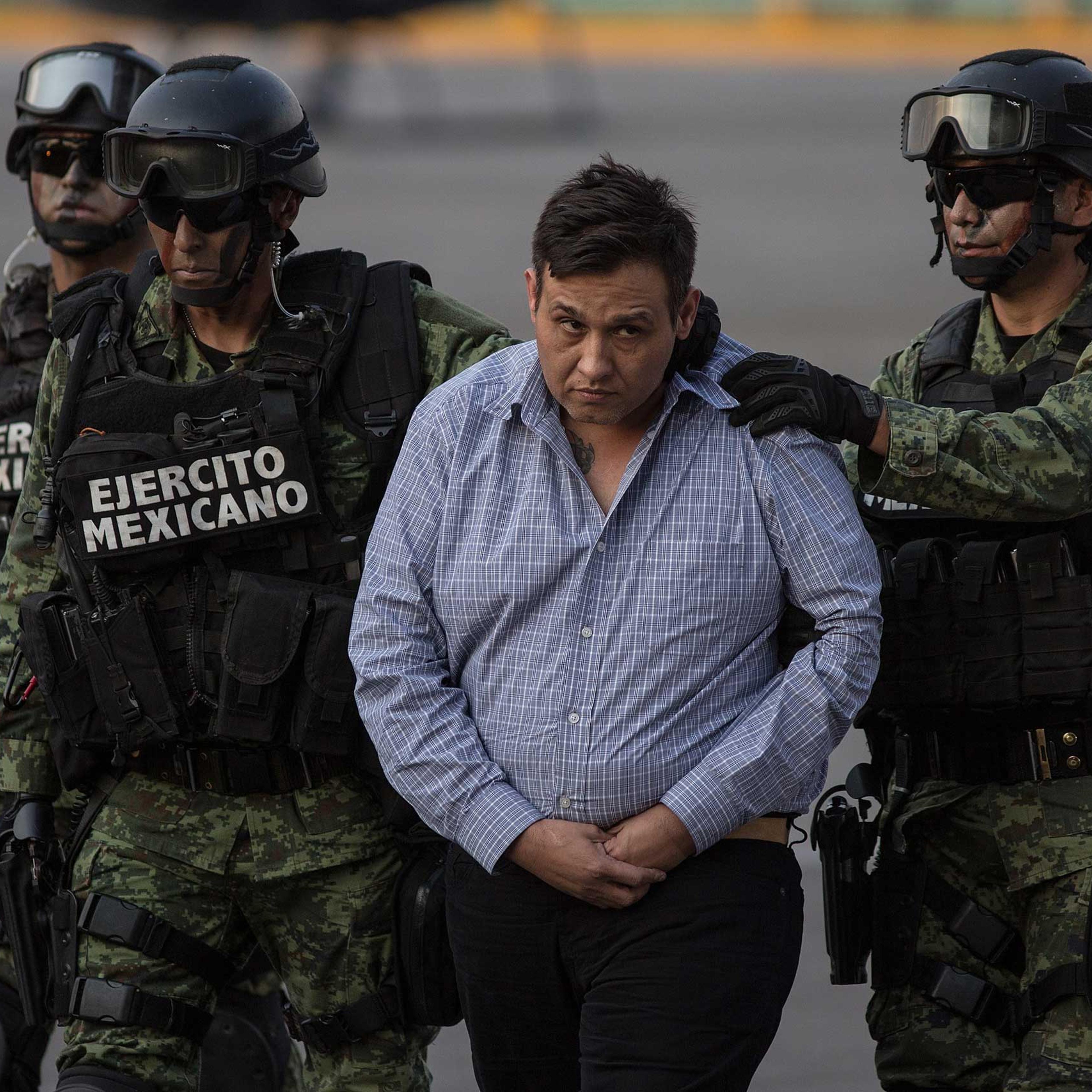 Soldiers escort Los Zetas drug cartel leader Omar Trevino Morales in Mexico City on March 4, 2015.