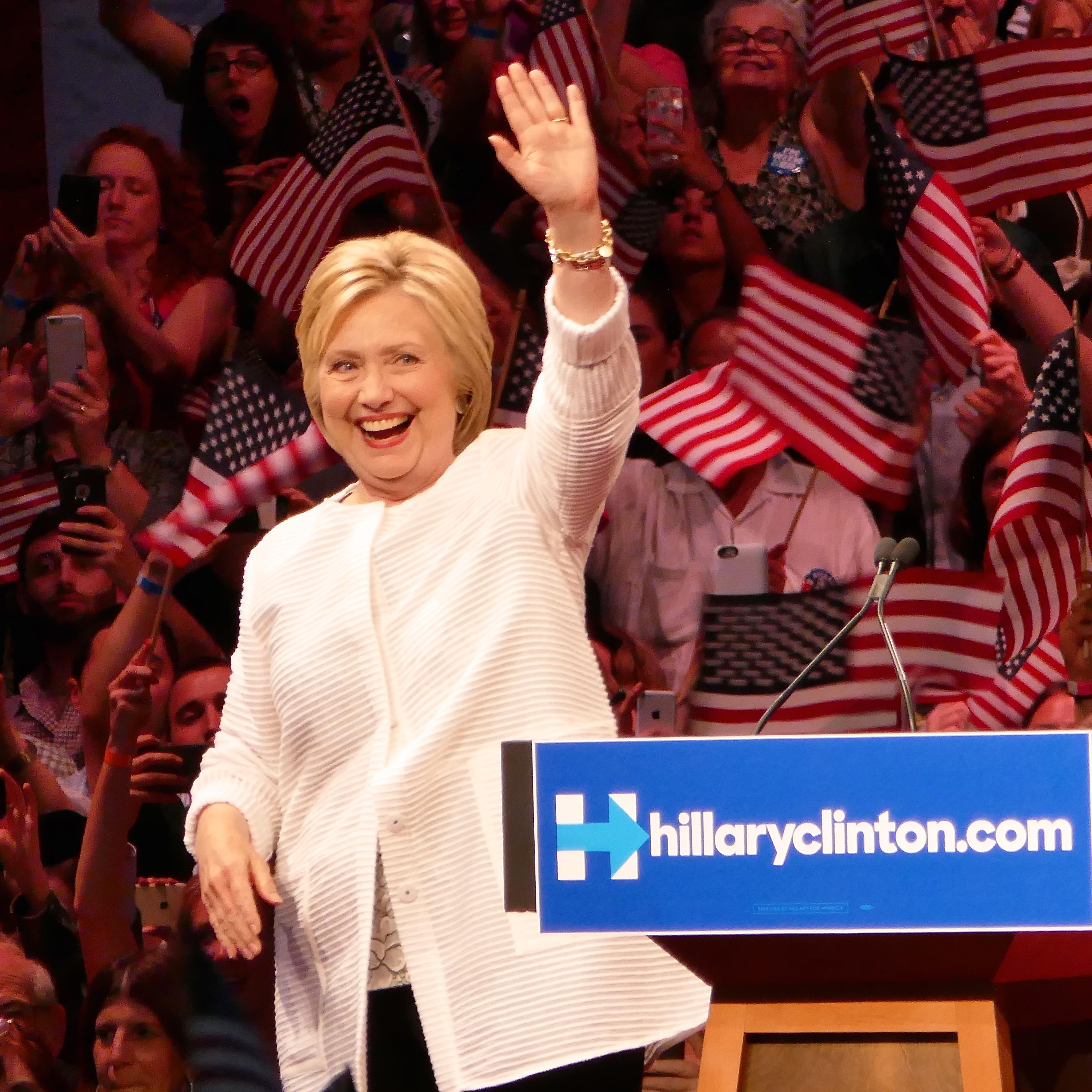Clinton claims nomination as primaries near end