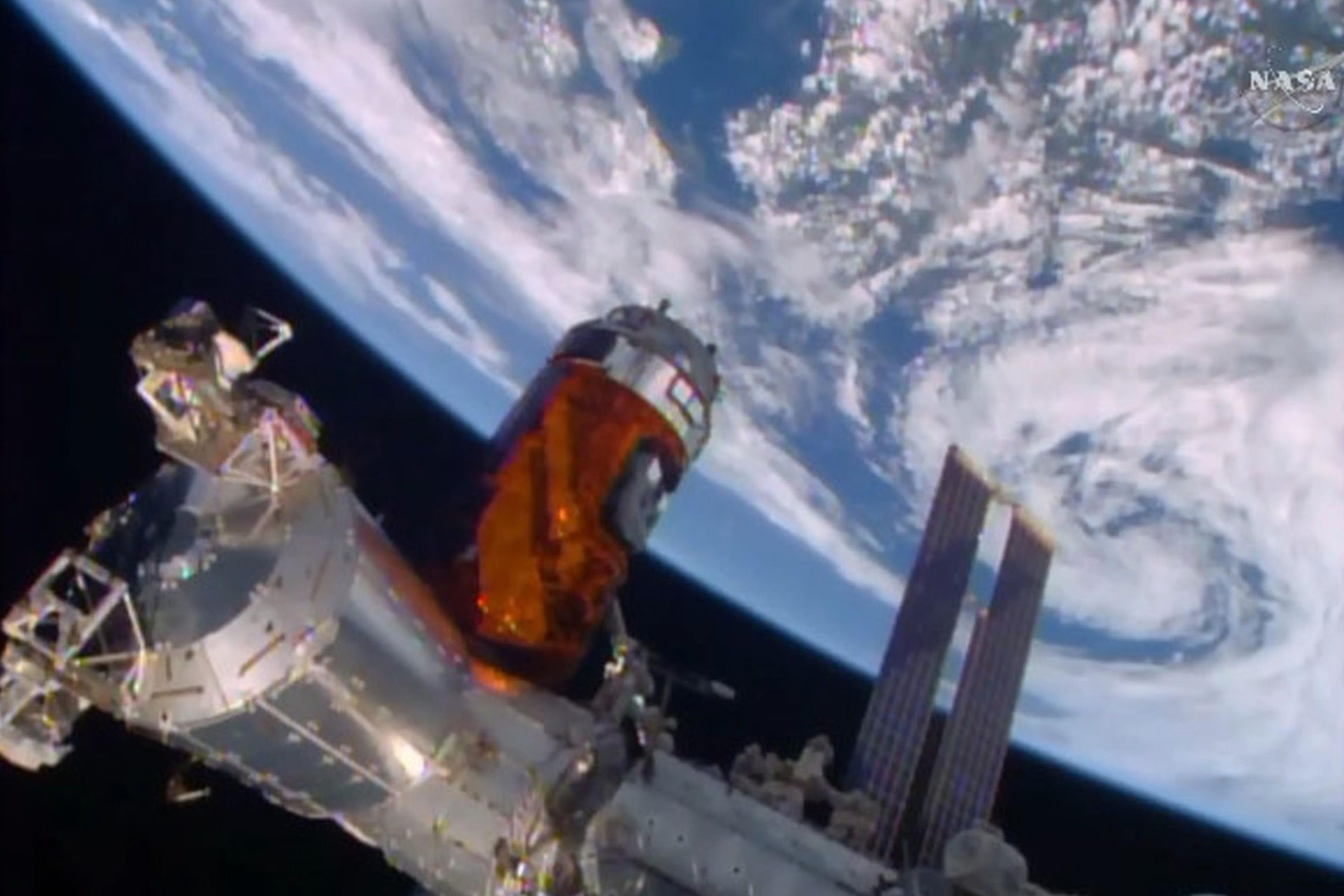 In this photo taken from NASA TV, the unmanned Japanese cargo ship, the Kounotori 5, arrives at the International Space Station on Aug. 24, 2015.