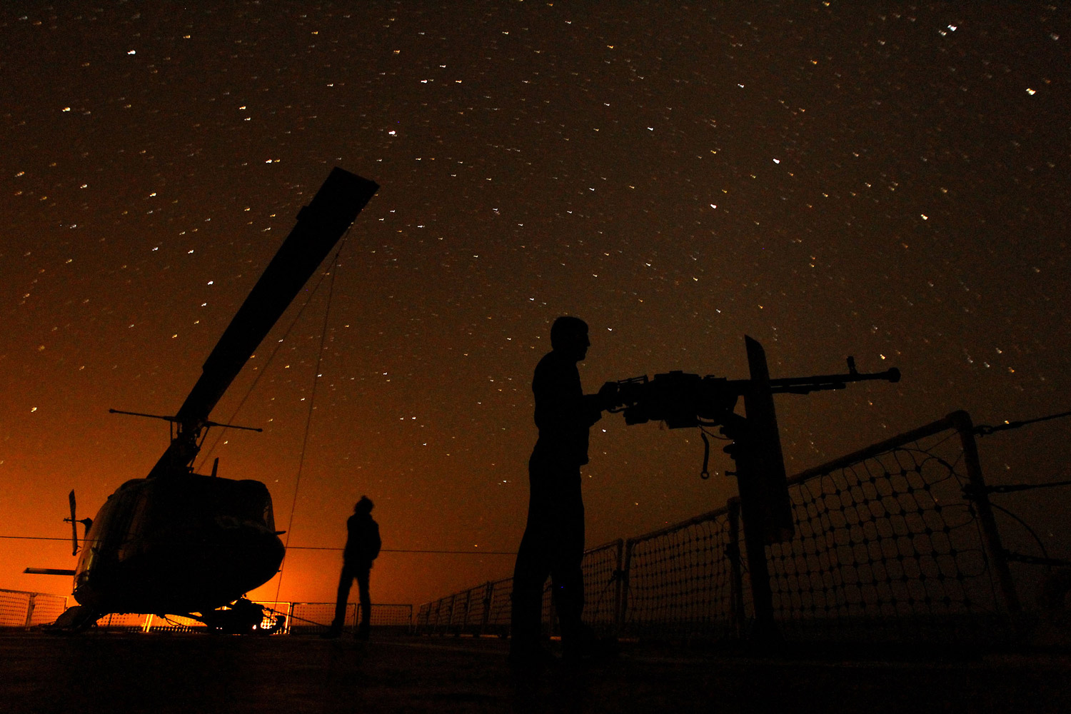 January 1, 2012. Iranian sailors aboard a ship in the Strait of Hormuz take part in a massive 10-day naval exercise. 