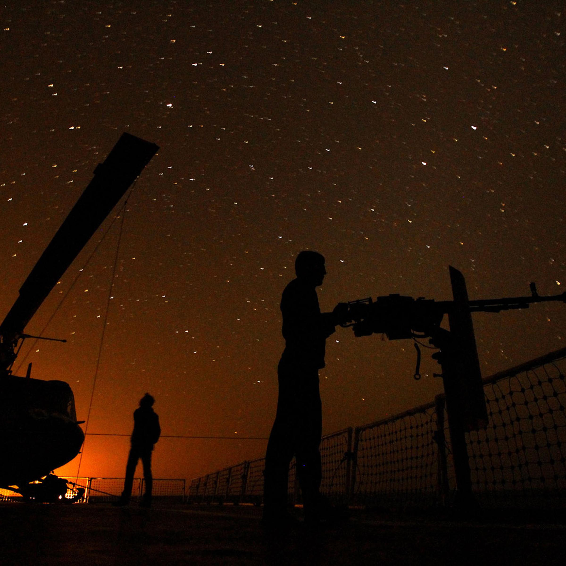 January 1, 2012. Iranian sailors aboard a ship in the Strait of Hormuz take part in a massive 10-day naval exercise.