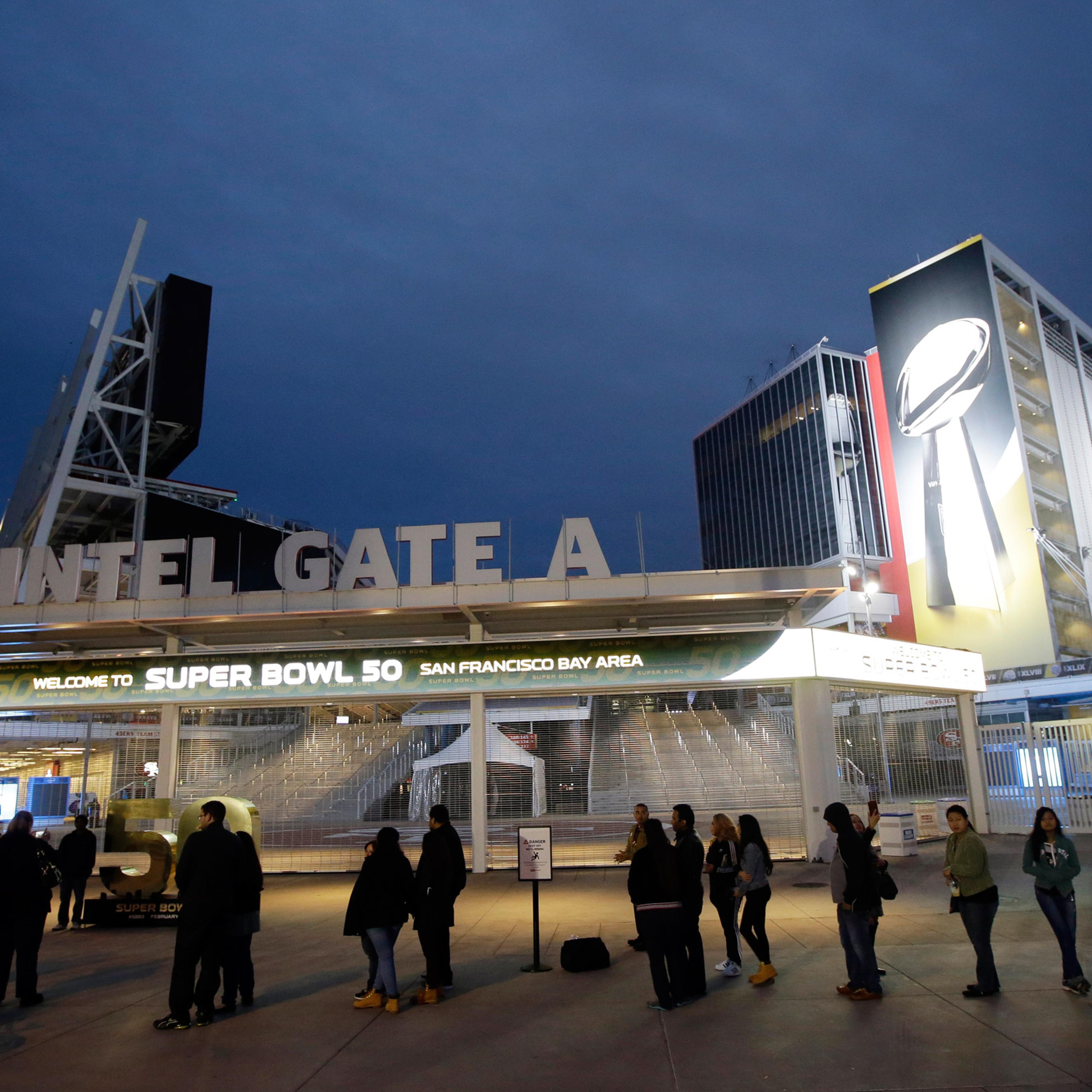 Visitors line up to pose for photos outside of Levi's Stadium Saturday, Jan. 30, 2016, in Santa Clara, Calif. Super Bowl 50, between the Carolina Panthers and Denver Broncos, will be played at Levi's Stadium Feb. 7. (AP Photo/Marcio Jose Sanchez)