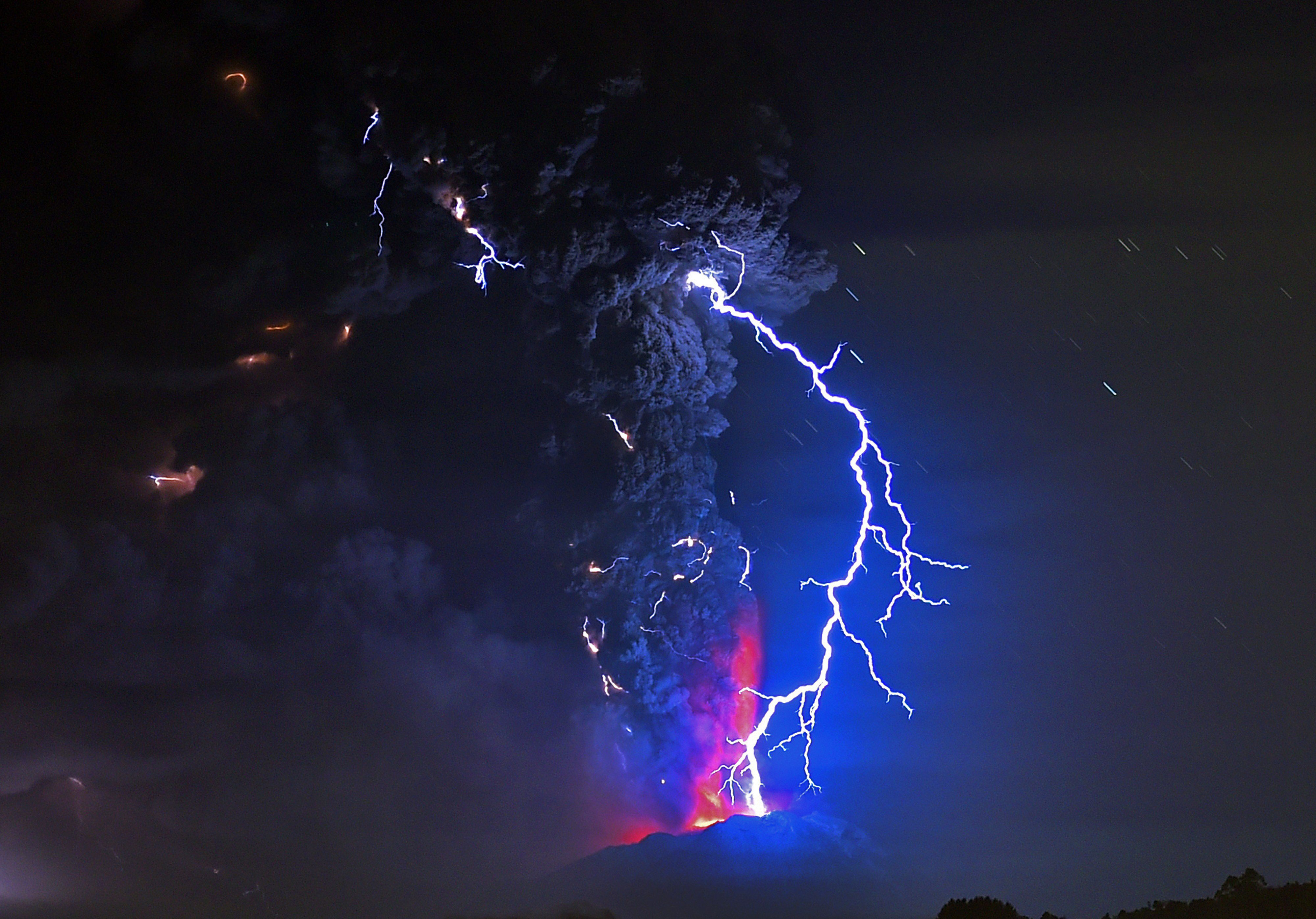 Lightning illuminates a cloud of ash as lava spews from the Calbuco volcano in southern Chile