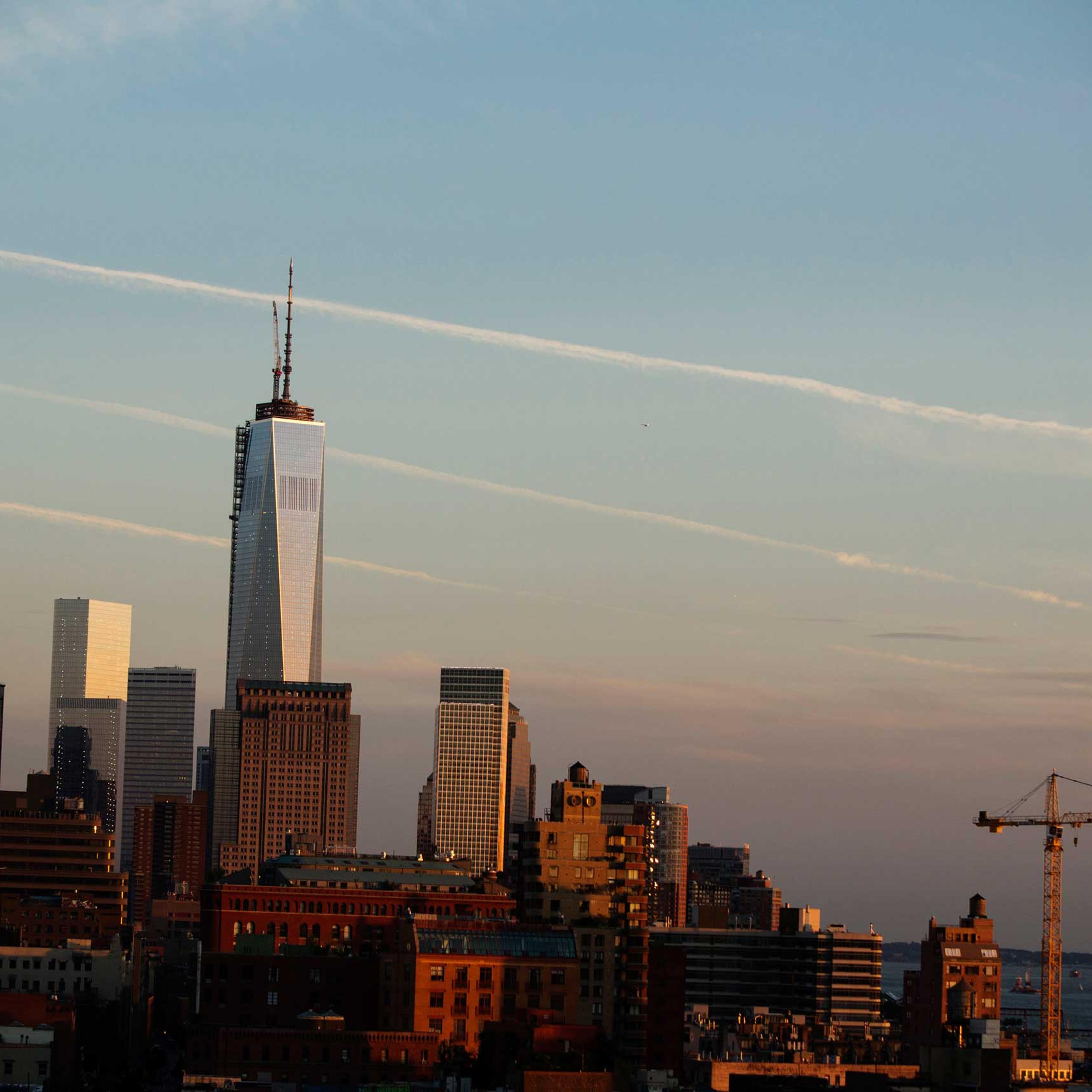 One World Trade Center rises above the Manhattan skyline as seen from the pool at the Gansevoort Meatpacking NYC on June 12, 2013.