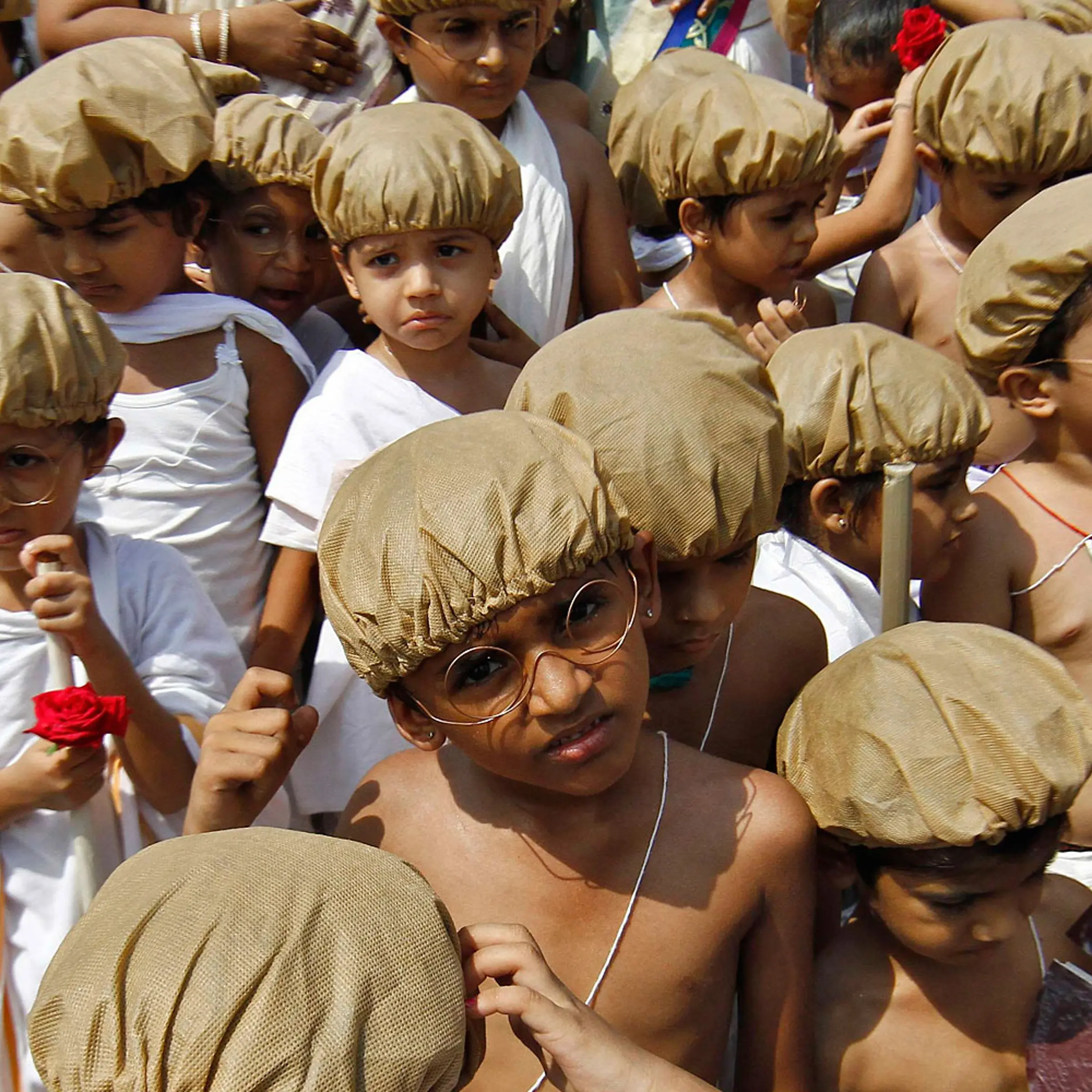 School children dressed as Mahatma Gandhi participate in celebrations marking the 144th birth anniversary of Gandhi, in the southern Indian city of Chennai