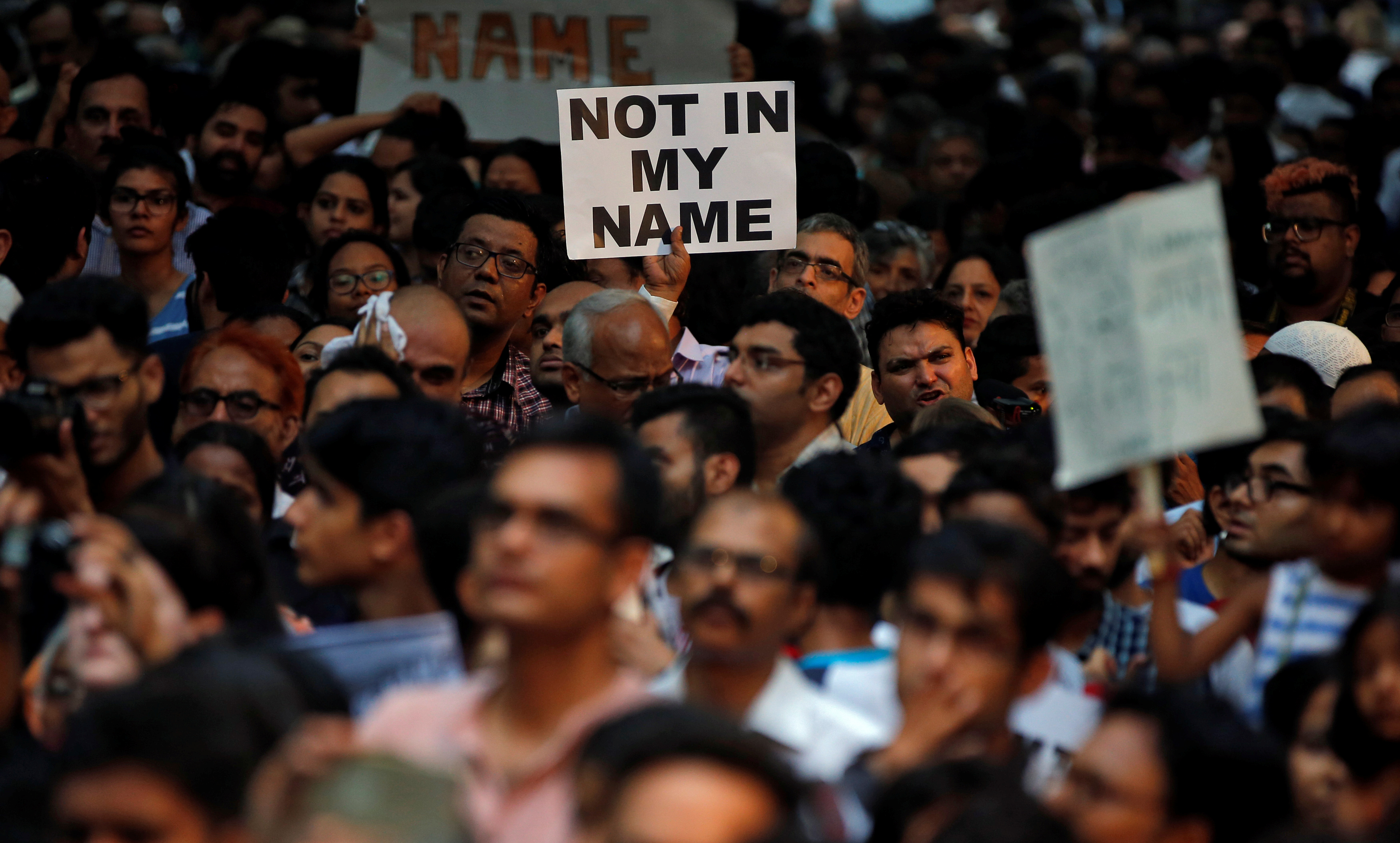 People protest against the recent cases of mob lynching of Muslims who were accused of possessing beef, in New Delhi