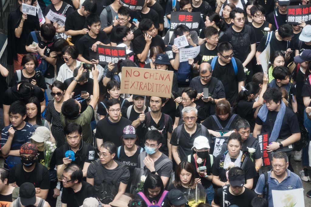 Protesters marched through the streets of Hong Kong holding