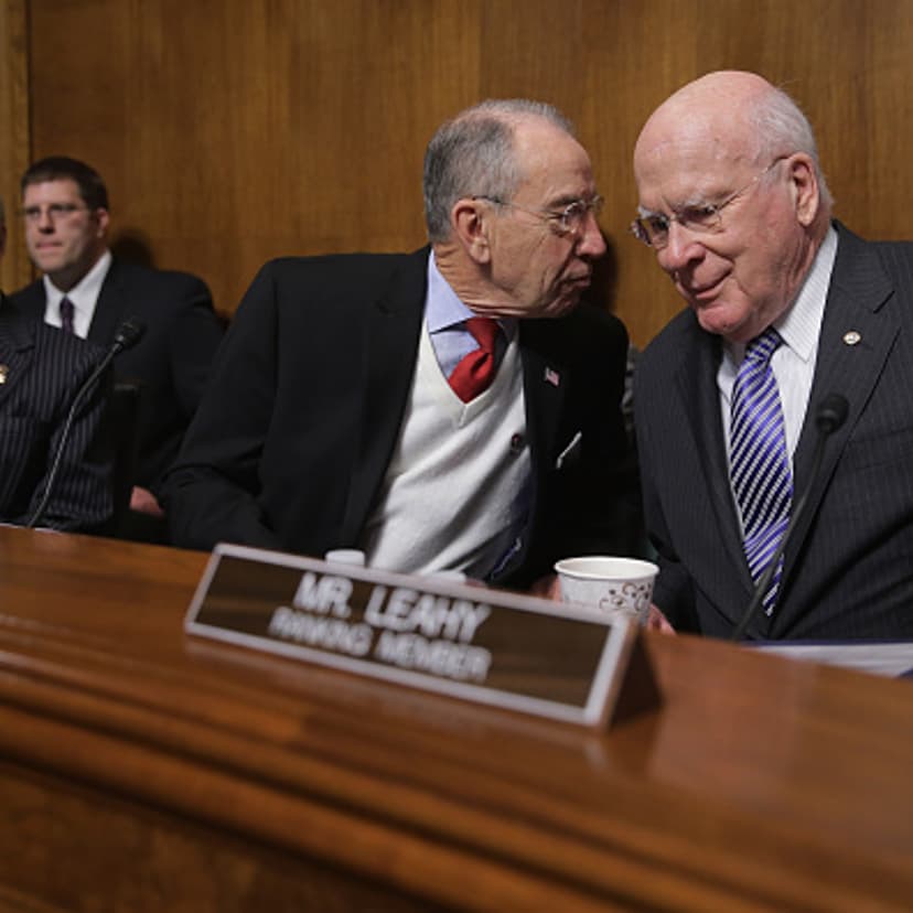 Senate Judiciary Committee Chairman Chuck Grassley (R-IA) (C) speaks with ranking member Sen. Patrick Leahy (D-VT) before a hearing about he impact of heroin and prescription drug abuse in the Dirksen Senate Office Building on Capitol Hill January 27, 20