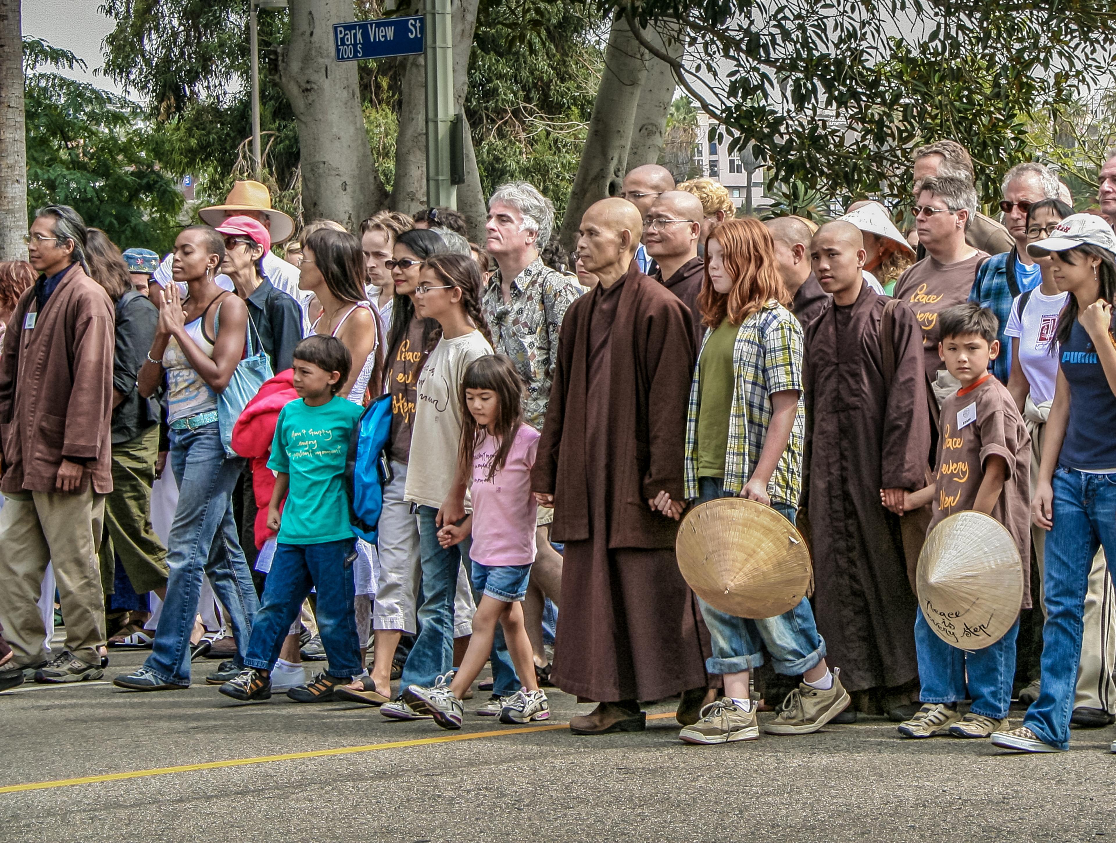Nhat Hanh, center, led a silent peace walk in Los Angeles in 2005, as the Iraq War escalated