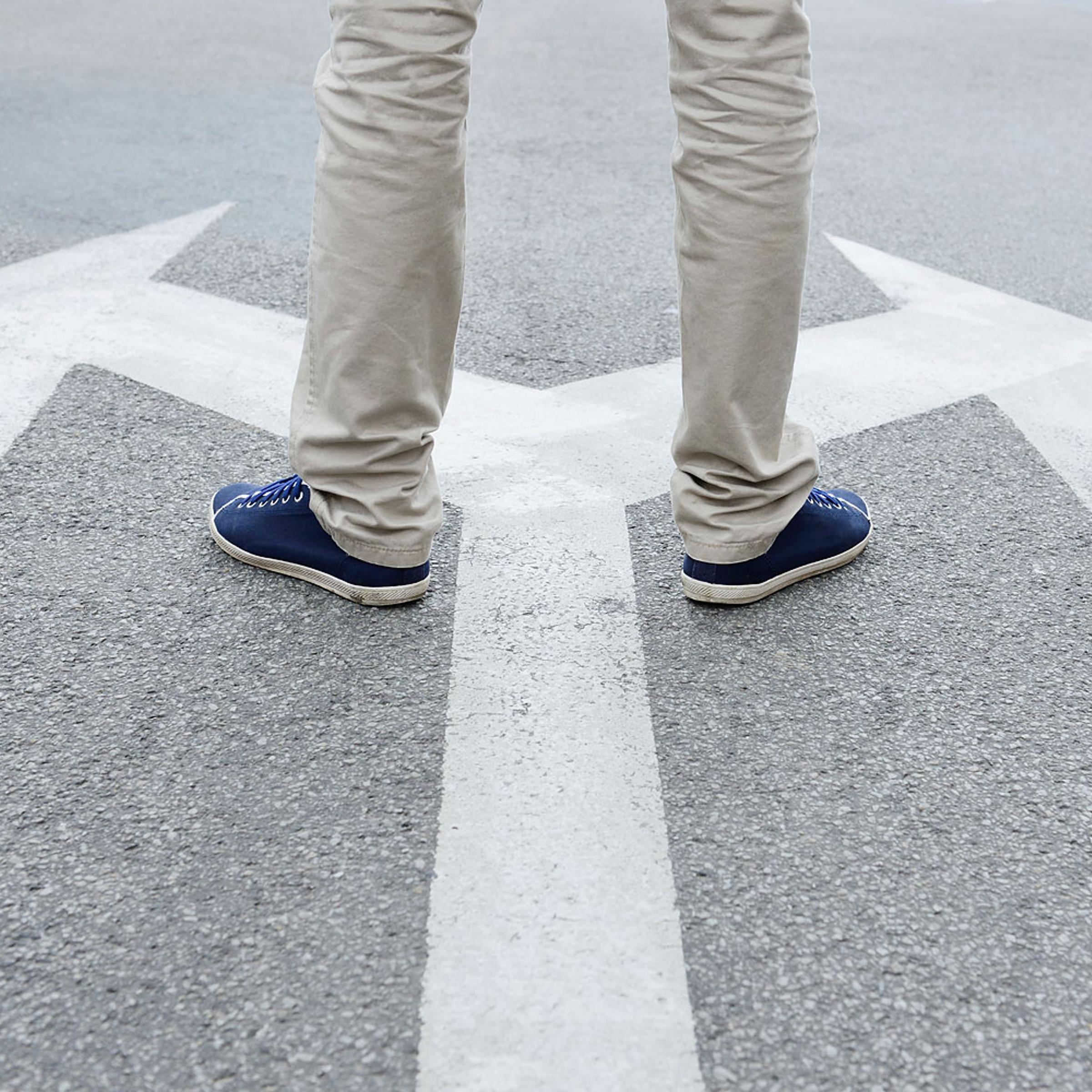 Man standing hesitating to make decision