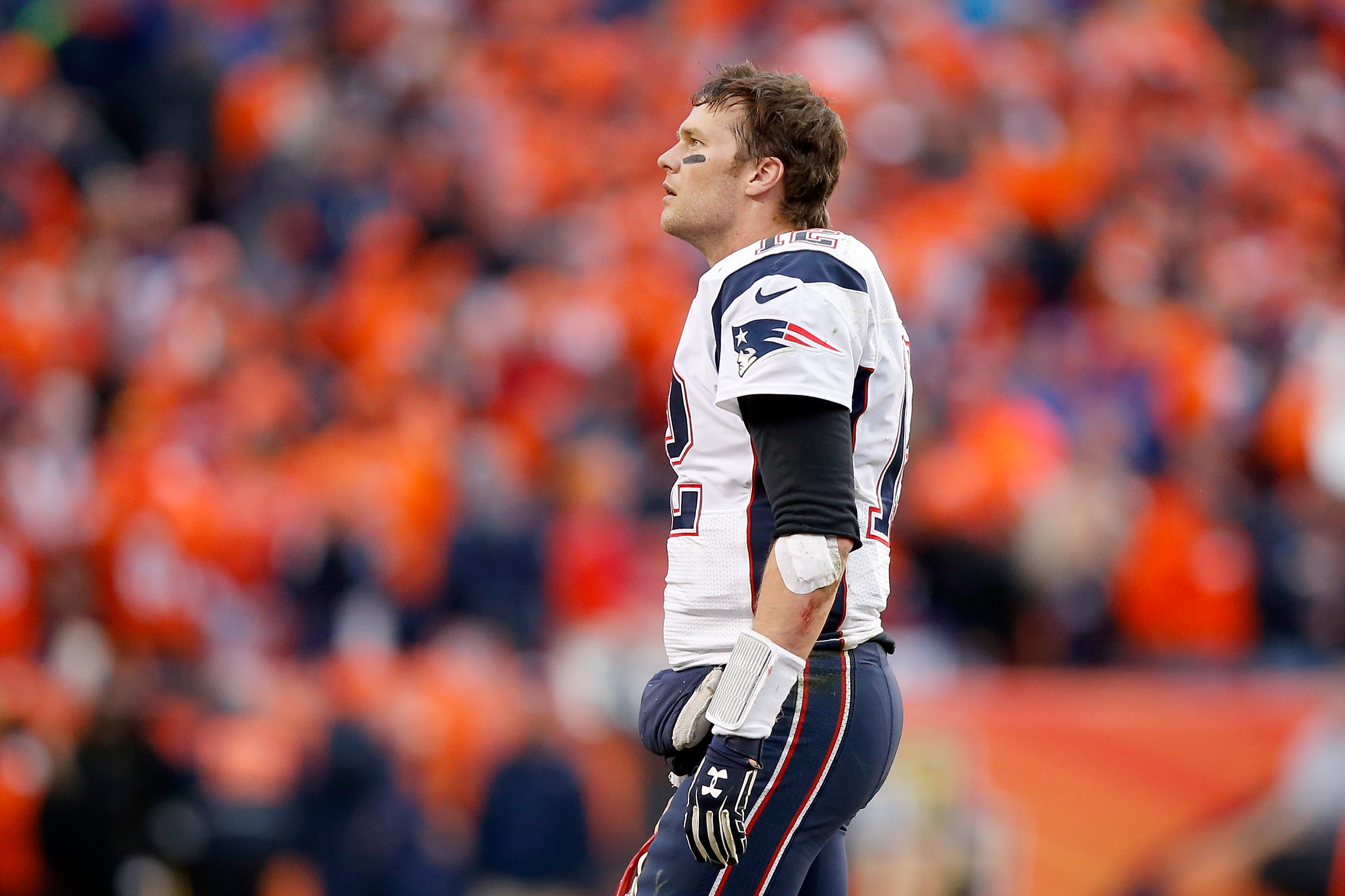 Tom Brady #12 of the New England Patriots looks on in the second half against the Denver Broncos in the AFC Championship game at Sports Authority Field at Mile High on January 24, 2016 in Denver, Colorado.
