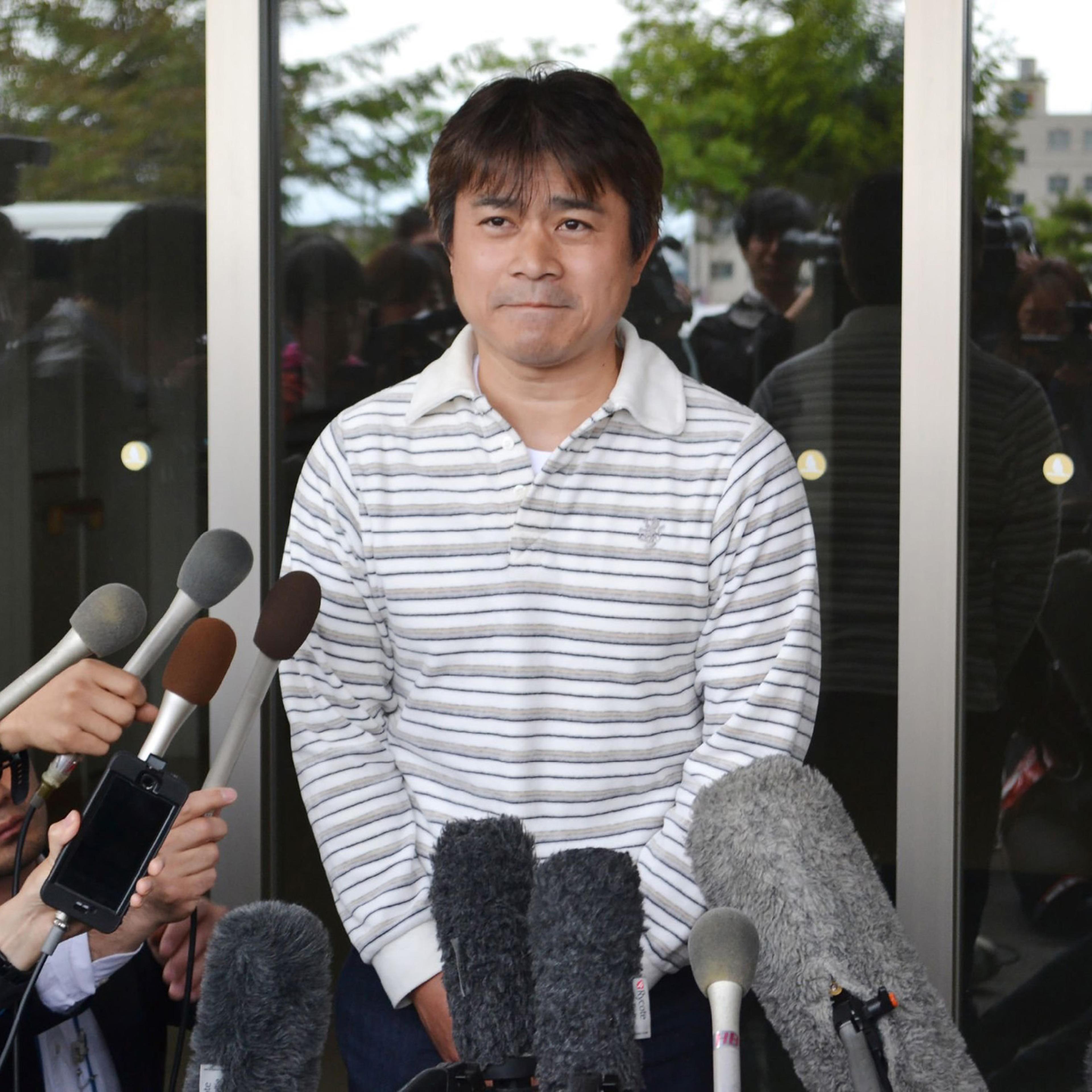 Father of Yamato Tanooka, a seven-year-old boy missing since being abandoned in a bear-inhabited forest in northern Japan, speaks to reporters in Hakodate on June 3, 2016.