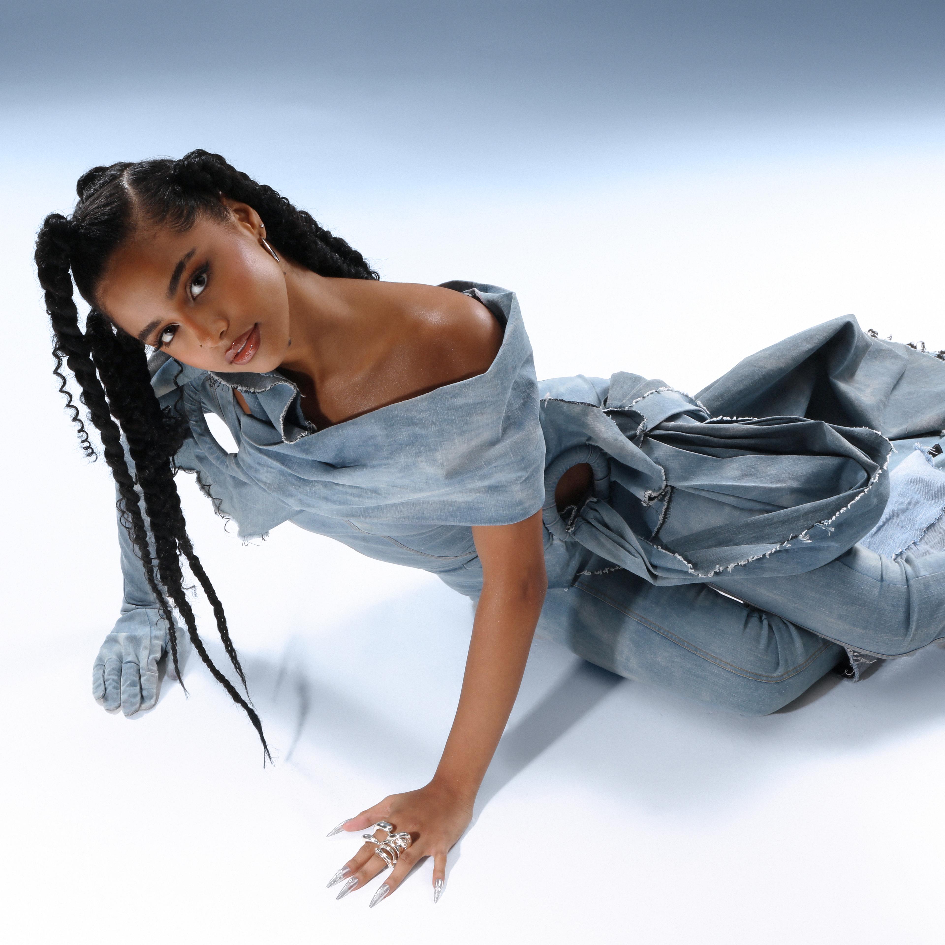 Tyla laying on the floor