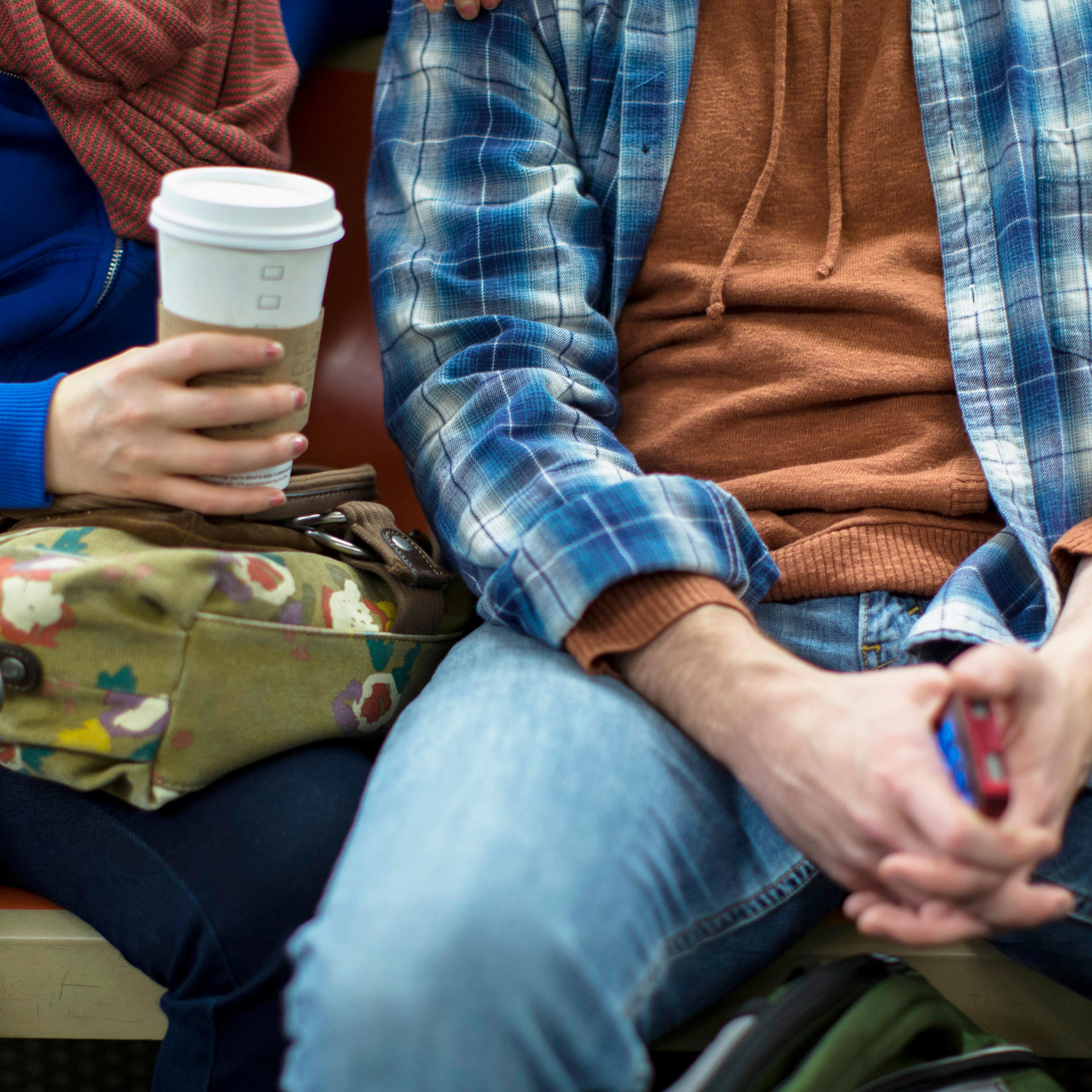 Couple sitting on urban subway