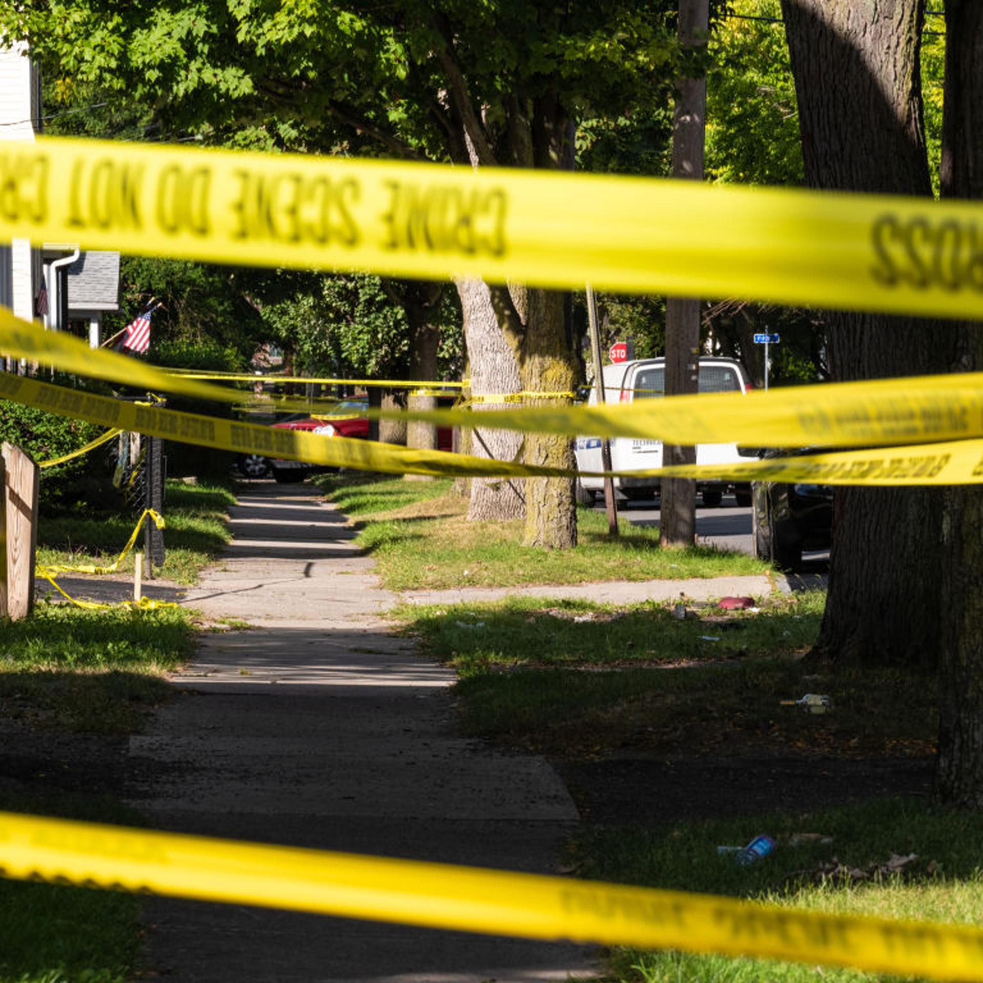 Police tape lines a crime scene after a shooting at a backyard party on September 19, 2020, Rochester, New York.