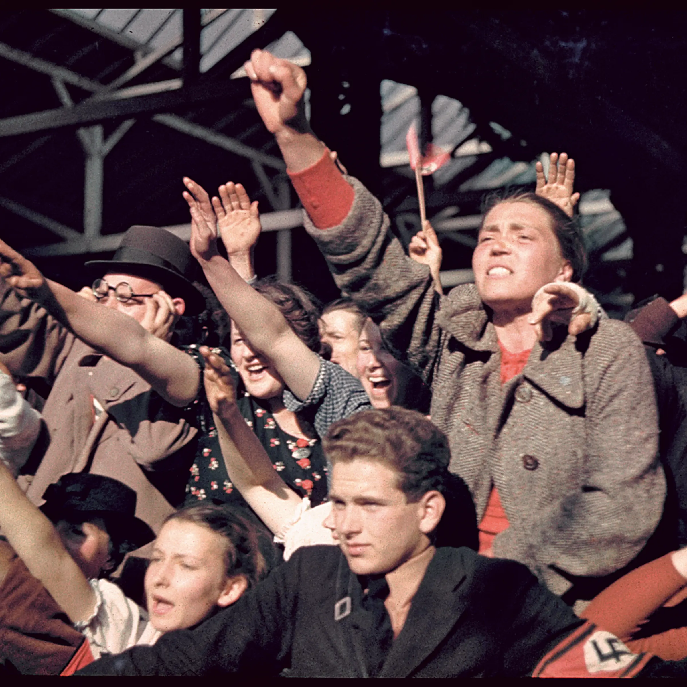 Austrians cheer Adolf Hitler during his 1938 campaign (before the Anschluss) to unite Austria and Germany.