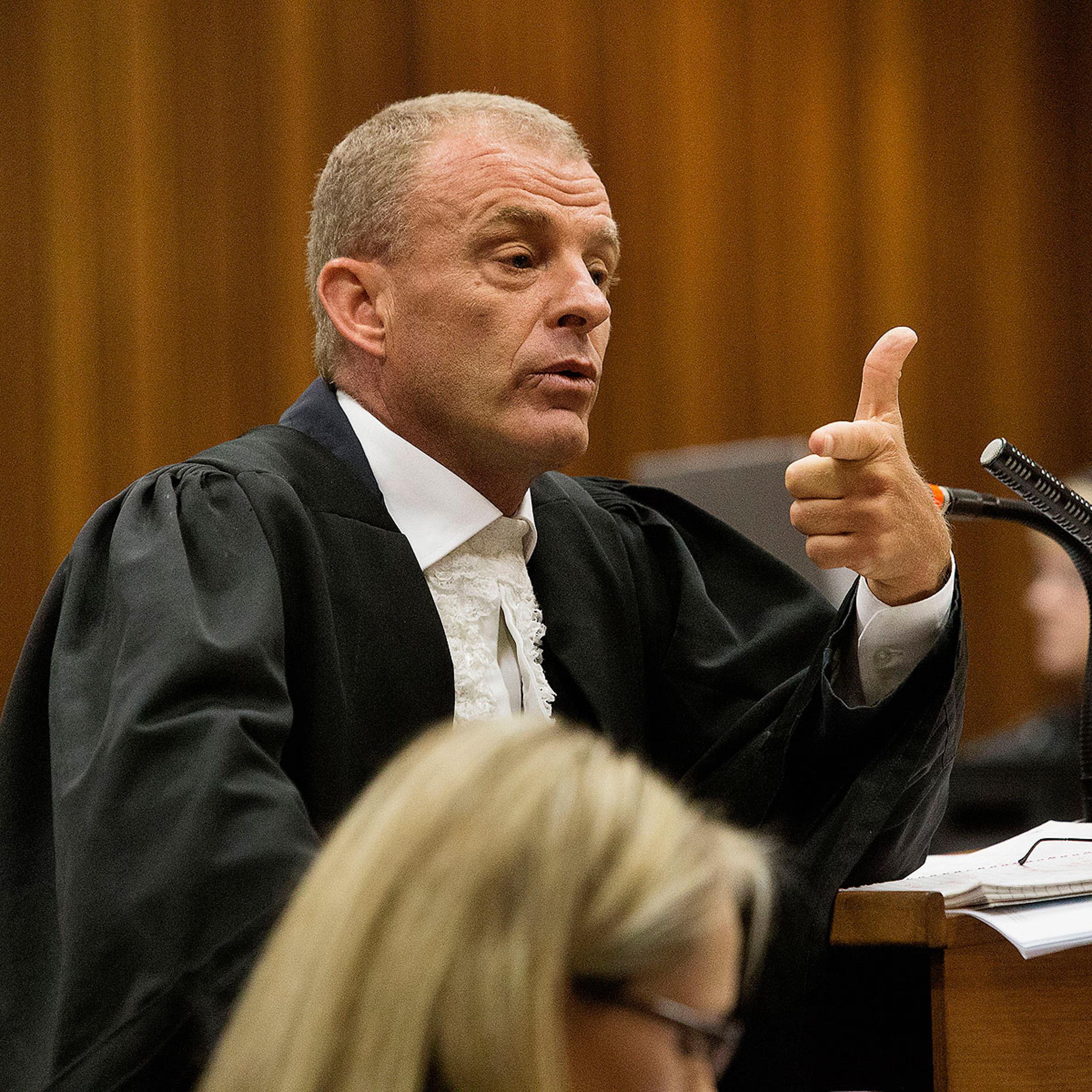 State prosecutor Gerrie Nel gestures as he cross examines Oscar Pistorius during his ongoing murder trial in Pretoria, April 10, 2014